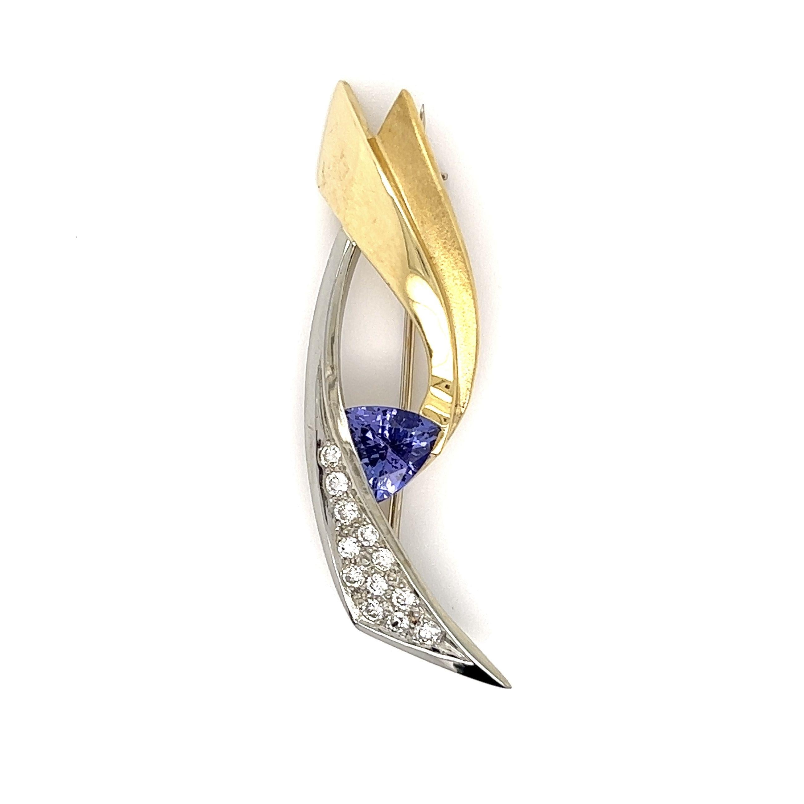 Awesome 1 Carat Trillion Tanzanite and 0.36tcw Diamond JOHN ATENCIO Brooch Pin. Beautifully Hand crafted in 2-Tone Yellow and White 18K Gold. Measuring approx. size 1.75” Long x 0.65” Wide. More Beautiful in real time! For that Special