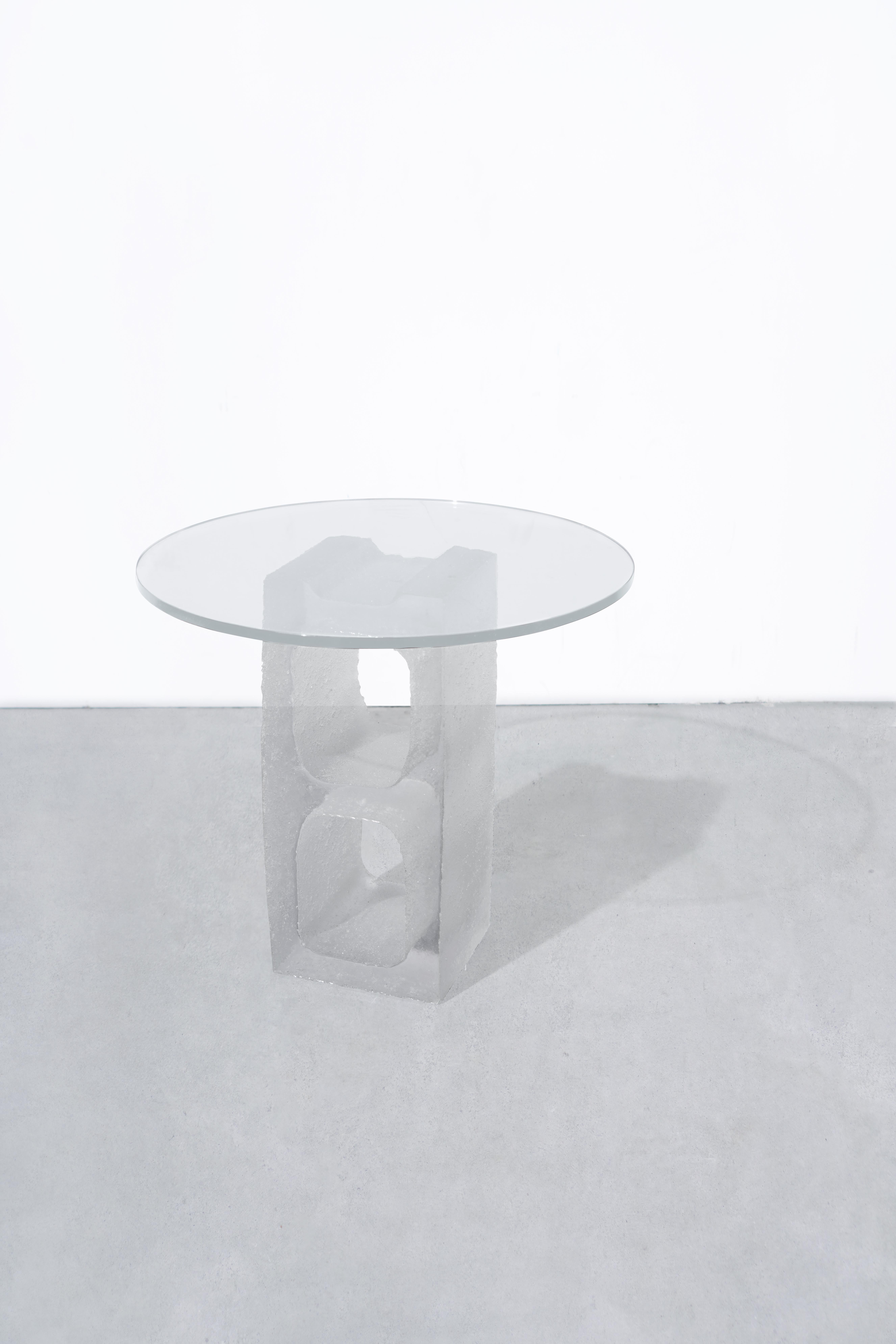 Description
1 Hand-molded, transparent resin cinder block, supporting a tempered glass table top.
Starphire glass top.
Modular.
Made to order in nyc.

Dimension
Cinder block length 18.75?
Cinder block width 7.5” 
Cinder block thickness