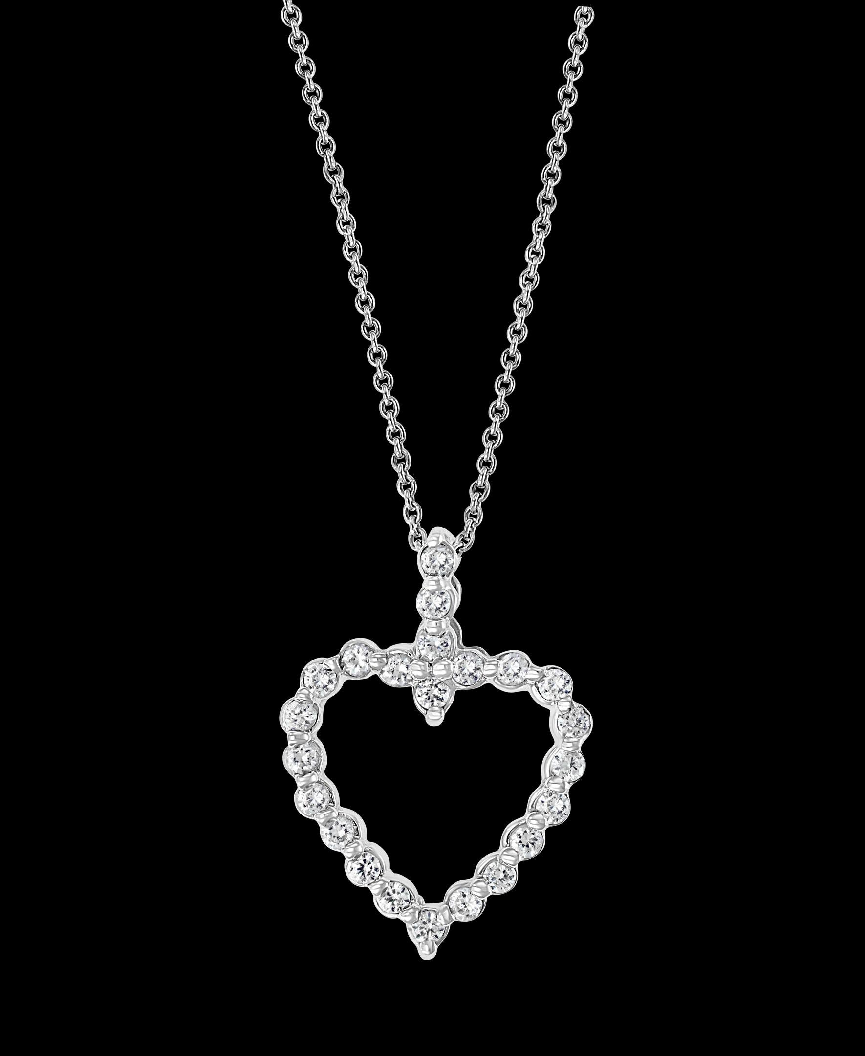 Approximately 1 Ct Diamond  Heart Pendant/ Necklace 14 Karat White Gold with Chain

Diamond Weight  approximately 1.0 Carats
Diamonds are Eye clean quality with lots of shine and brilliance!

14 K gold Weight  4.5 Grams
Very affordable price for