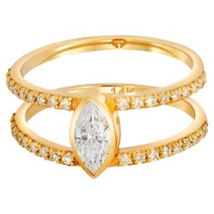 1 ct Marquise moissanite engagement ring in 14k gold. 