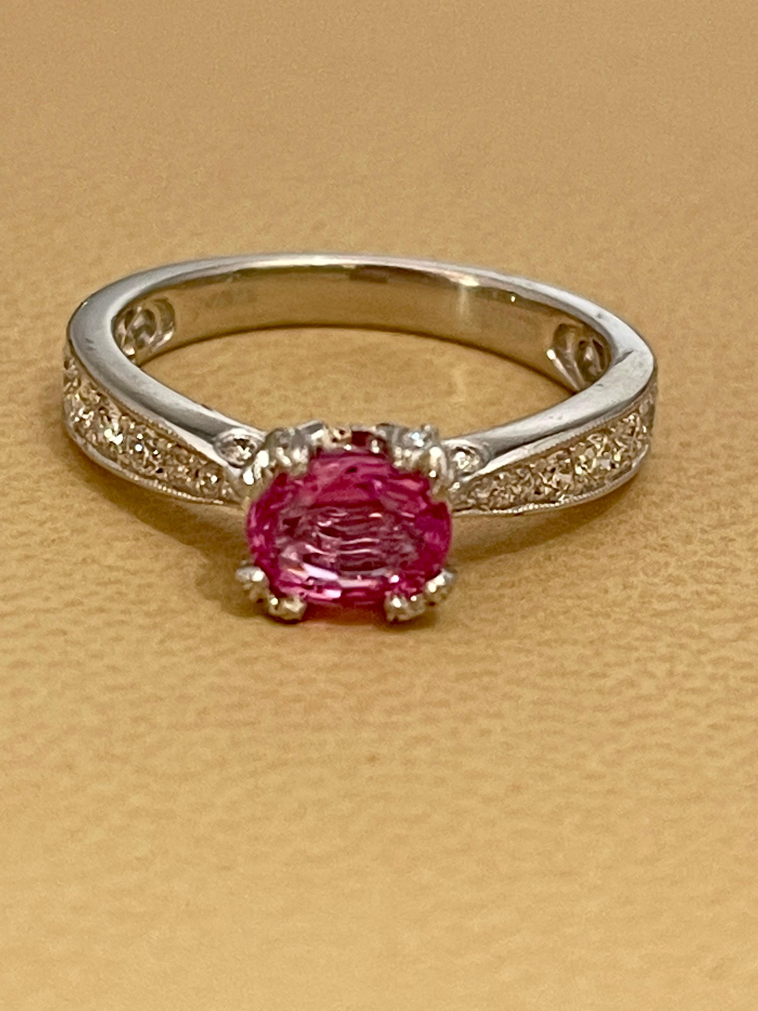 A classic, Ring 
1 Ct Oval Pink Sapphire & 1.25 Ct Diamond Ring in Platinum 
Natural Pink Sapphire in Oval   shape , Pretty color, luster is amazing and  have very little inclusions .
There are brilliant cut diamonds around the pink sapphire
Diamond