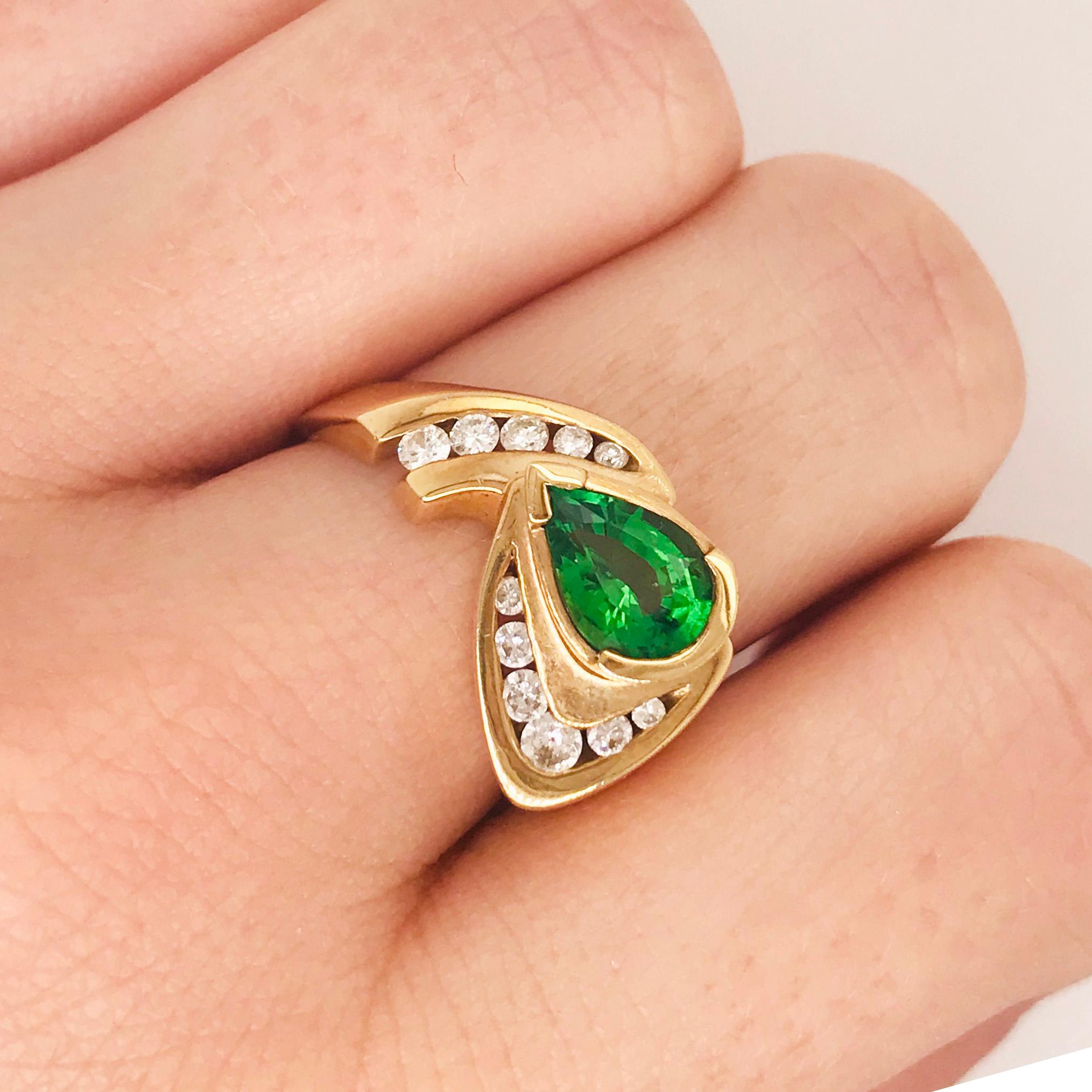 The vibrant custom chrome tourmaline and diamond ring is bold and beautiful! With a pear shaped genuine green/chrome tourmaline gemstone set in center. The chrome tourmaline has a very bright green color that is the most valuable of all tourmaline