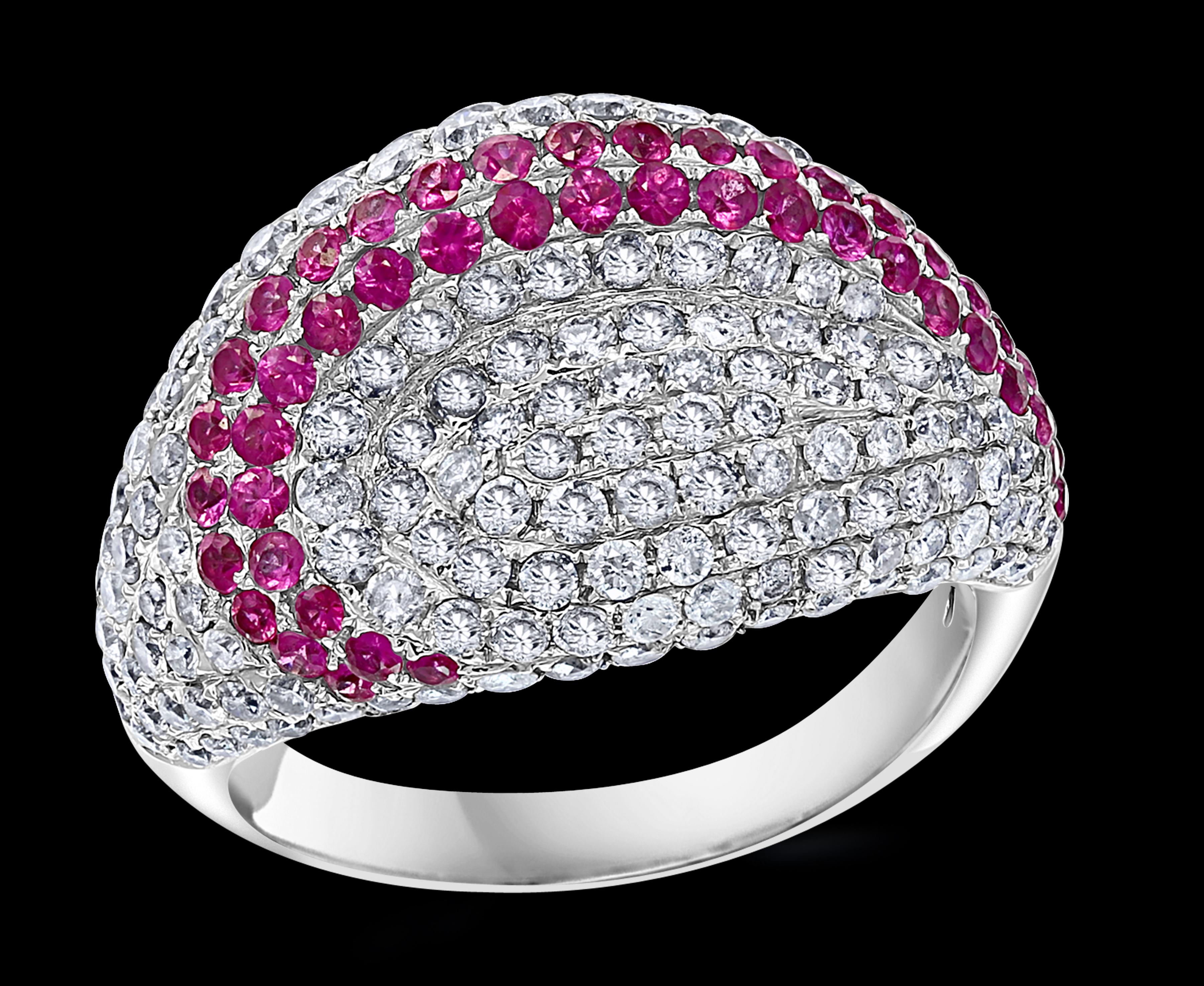 A classic, Cocktail ring 
Approximately 1 Ct natural Pink sapphire and Approximately 4  Ct  Diamond 18 Karat  White gold   Ring
200 pieces of diamonds totaling approximately 4 ct
 All round brilliant cut diamonds
18 Karat White  Gold: 8.5 Grams
