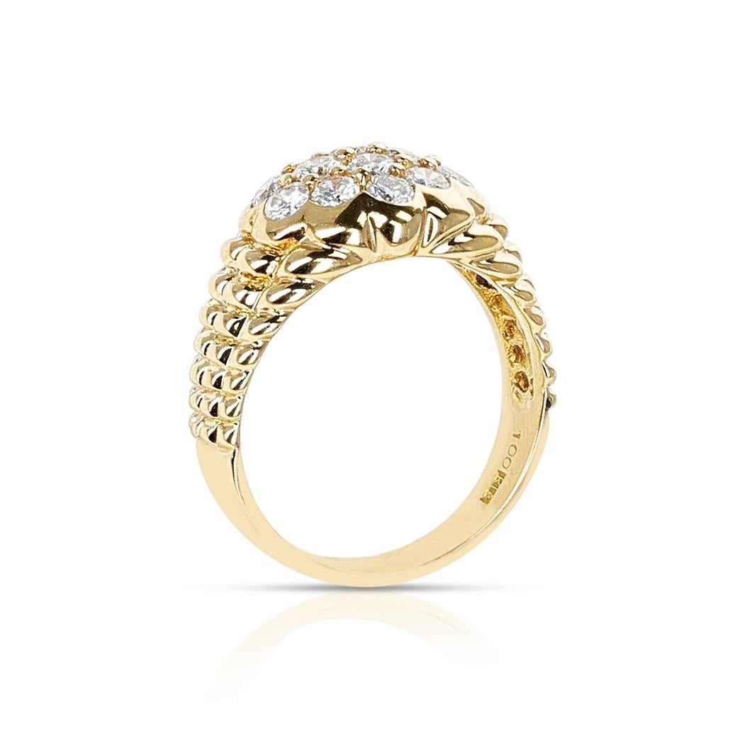 A stunning Diamond Floral Cluster Ring with Textured Gold Design made in 18 Karat Yellow Gold. The total weight of the diamonds is appx. 1 carat. The total weight of the ring is 5.75 grams. The ring size is US 6.25. 