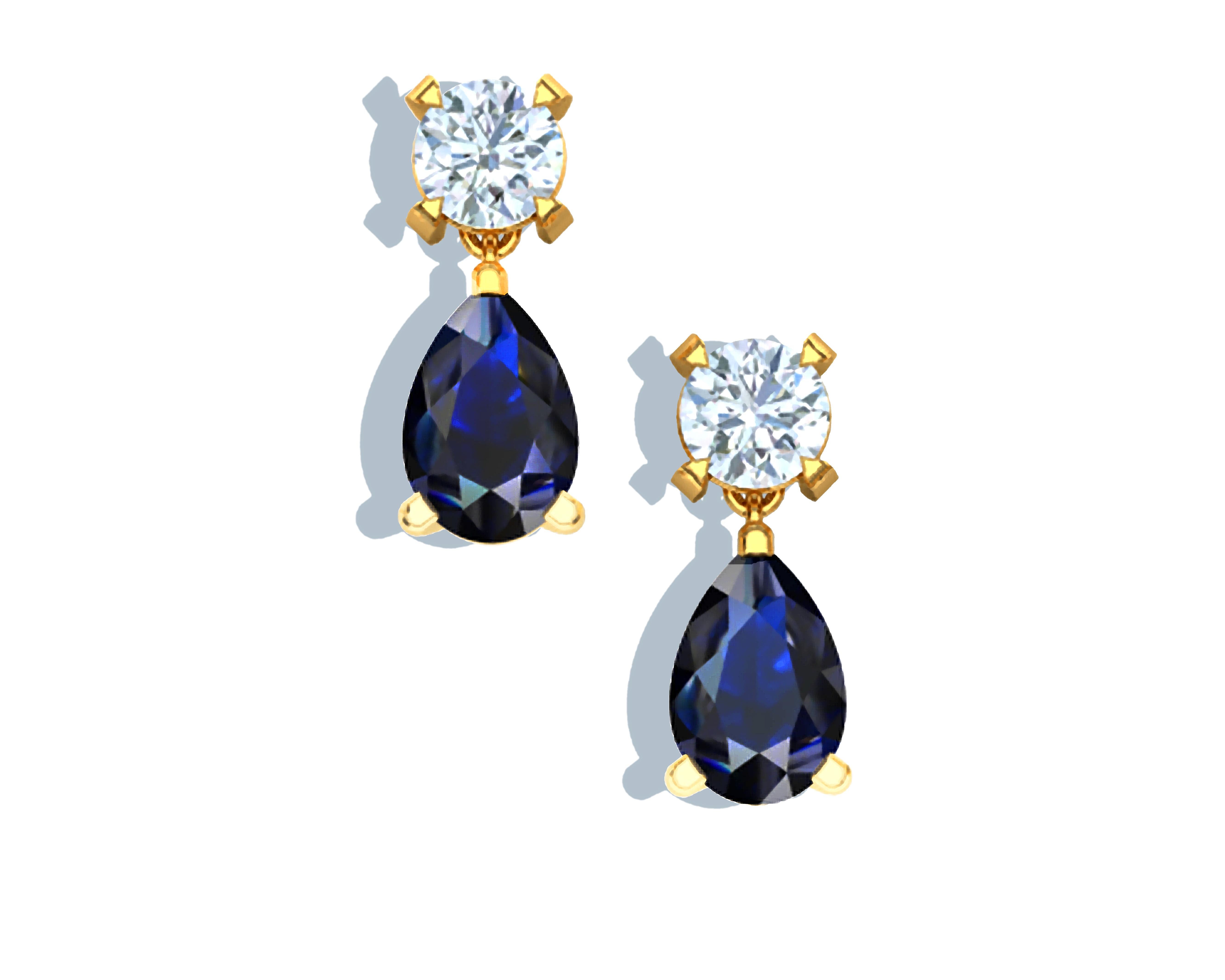 This stunning pair of sapphire and diamond drop earrings contain the following.  There are two pear shape sapphires that weigh approx. .30-.35 carats each and a round diamond which weighs approx. .12 to .15 carats.  The diamonds have the color and