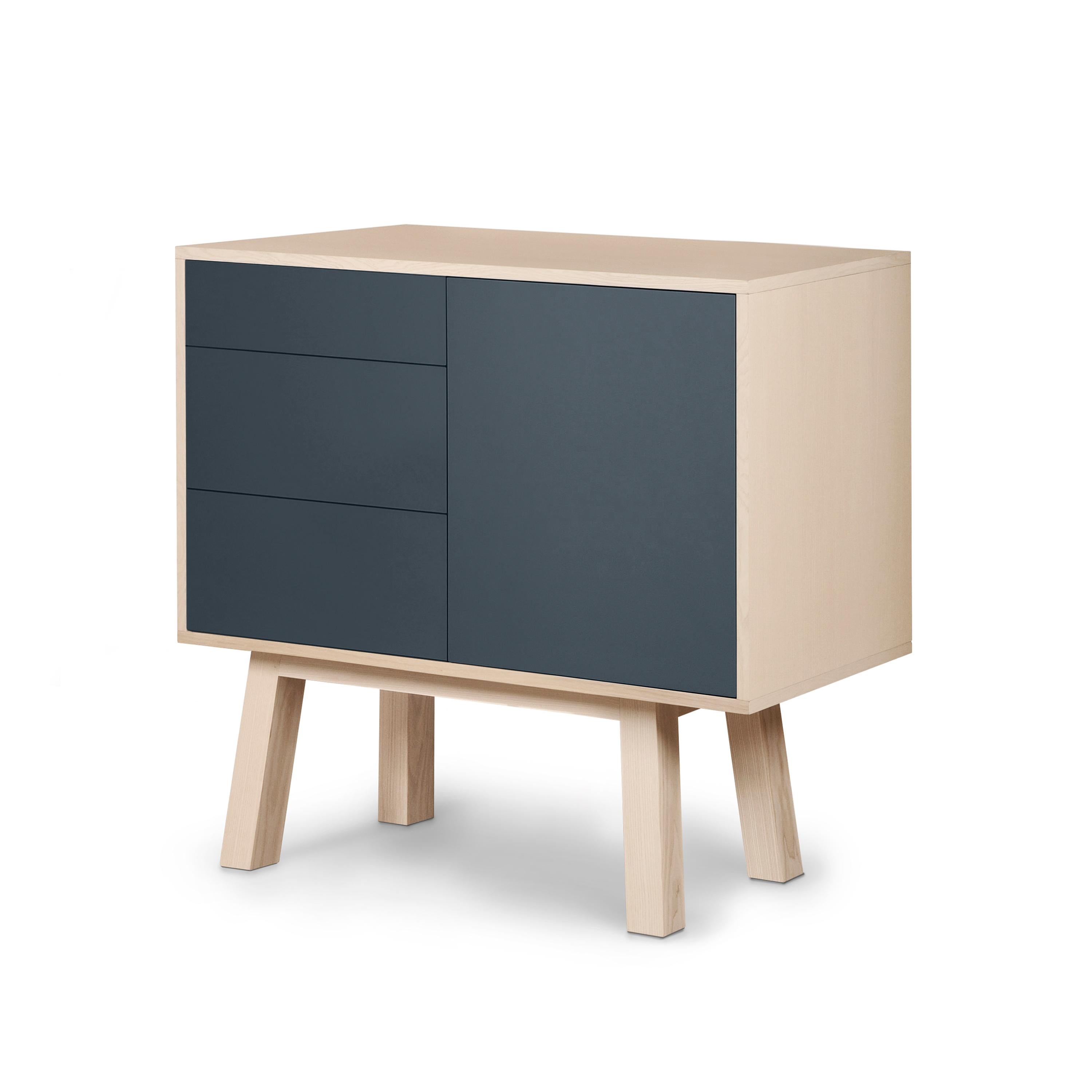 This 1-door and 3-drawer sideboard is designed by Eric Gizard - Paris.

It is 100% made in France with solid ash wood, veneer and lacquered doors in MDF panels. 

Each door and each drawer opens with a 