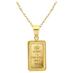 Barre d'or du Credit Suisse de 1 gramme avec lunette polie en or jaune 14k