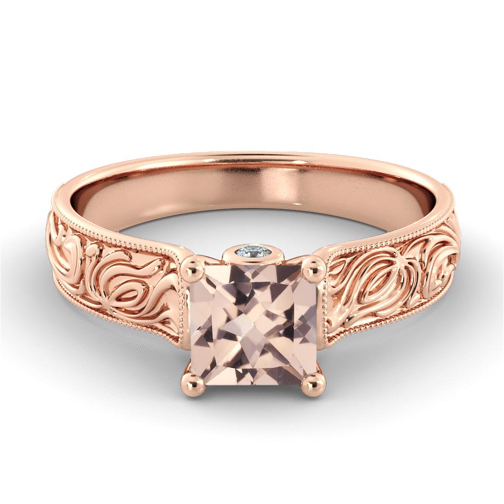 Gorgeous hand engraved vintage setting ring set with a beautiful morganite center stone and diamond side stones. Center stone is of 1 carat, natural, princess shape, peach/pink color morganite and it is surrounded with 2 natural diamonds.
 
Main