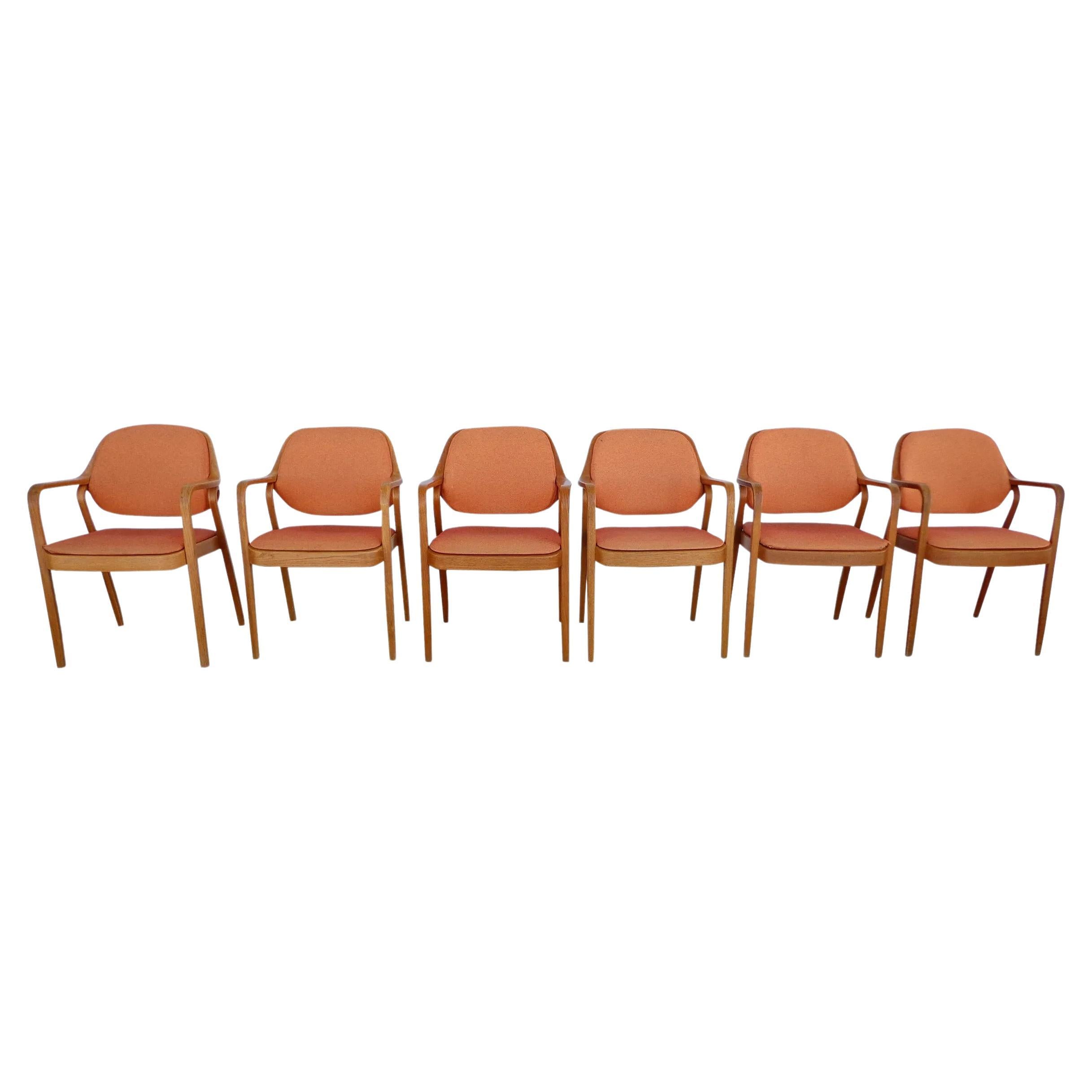1 vintage Knoll Don Petitt model #1105 oak armchair

Bentwood armchairs by Don Petitt for Knoll. Sculpted oak comprise legs and arms as well as the seat back frames. Chairs feature original Knoll orange upholstery.