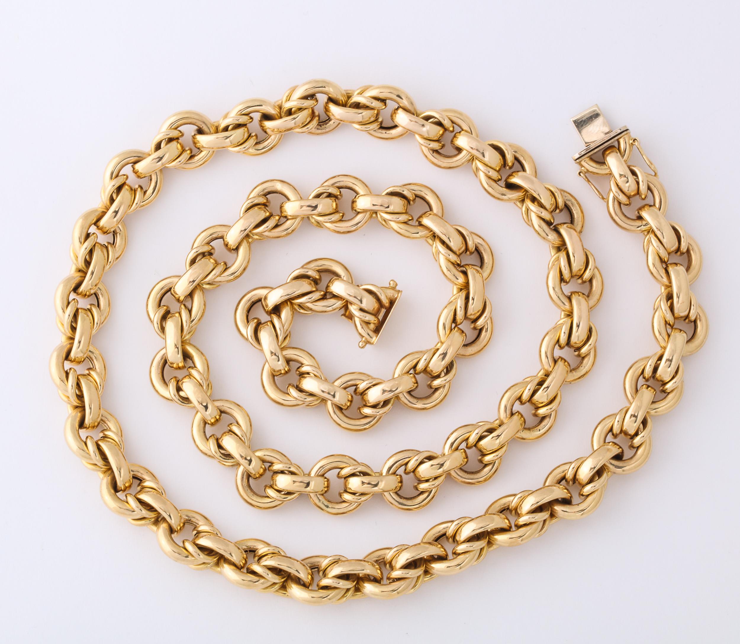 Handsome 14kt Yellow Gold Round link Chain with bar and interlocking connections.  Very 1960s.  Heavy & long chain which can be doubled or worn long - with or without a Pendant Brooch to dress it up or dress it upeven  a notch further.  Marked CIT