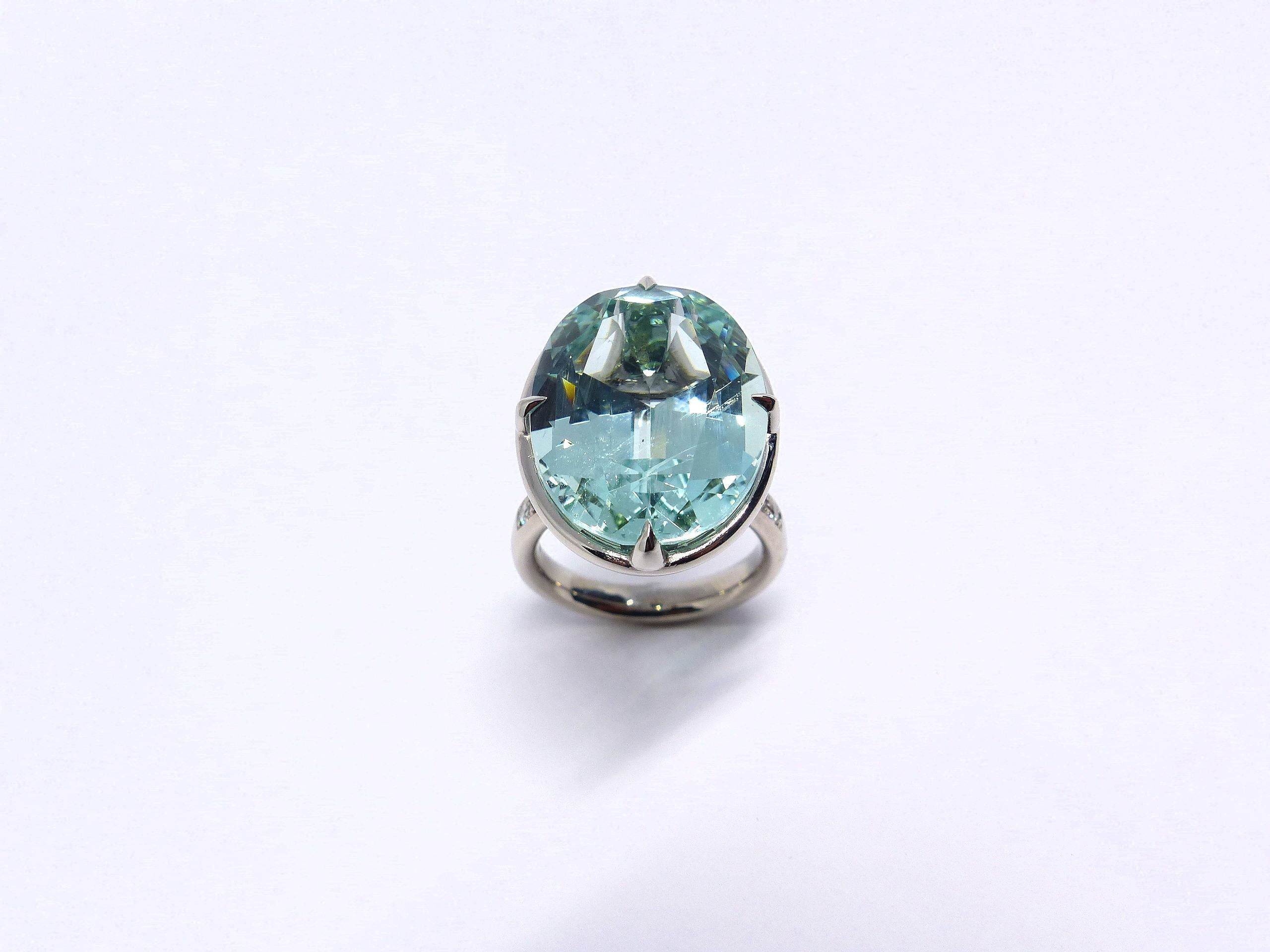 Thomas Leyser is renowned for his contemporary jewellery designs utilizing fine gemstones.

This 18k white gold ring is set with 1x fine green Beryl in magnificient blueish/greenish colour and large facettes (oval, 21x16mm, 19.53 carat) + 14x