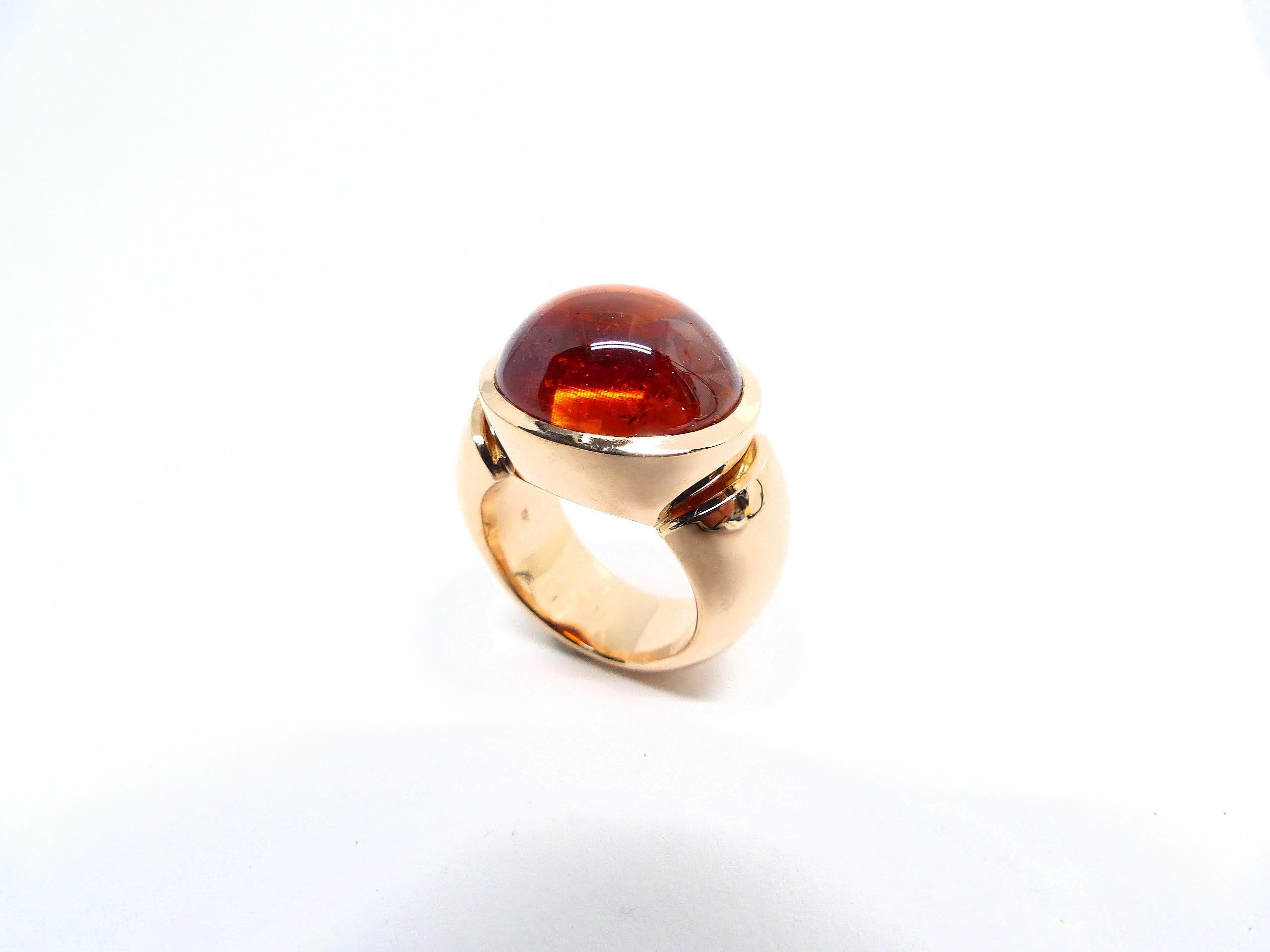 Thomas Leyser is renowned for his contemporary jewellery designs utilizing fine gemstones.

This 18k red gold ring (32.35g) is set with 1x fine Mandarine Garnet Cabouchon in magnificient deep orange colour (16.5x14.5mm, 26.23ct). Ringsize 53.5 (6