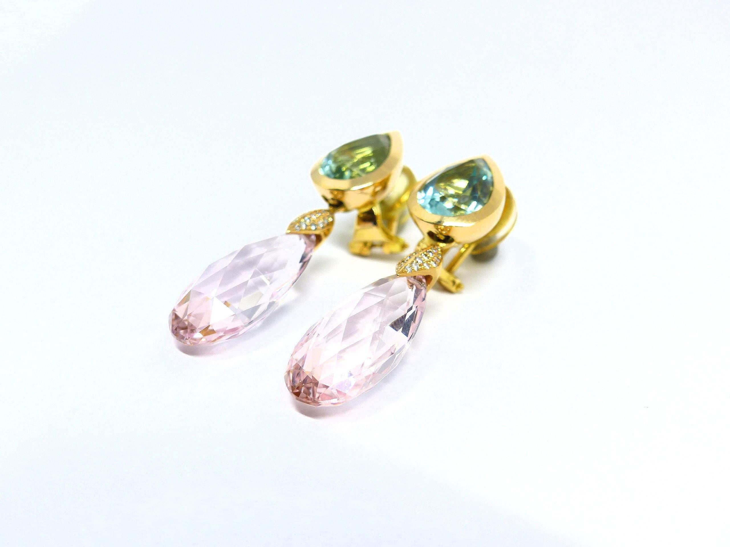 Thomas Leyser is renowned for his contemporary jewellery designs utilizing fine gemstones.

These 18k Rose Gold (10.26g) pair of earrings are set with 2x fine Heliodor (facetted, pear-shape, 12x9mm, 6.15ct) and 2x fine Morganites (briolette cut,