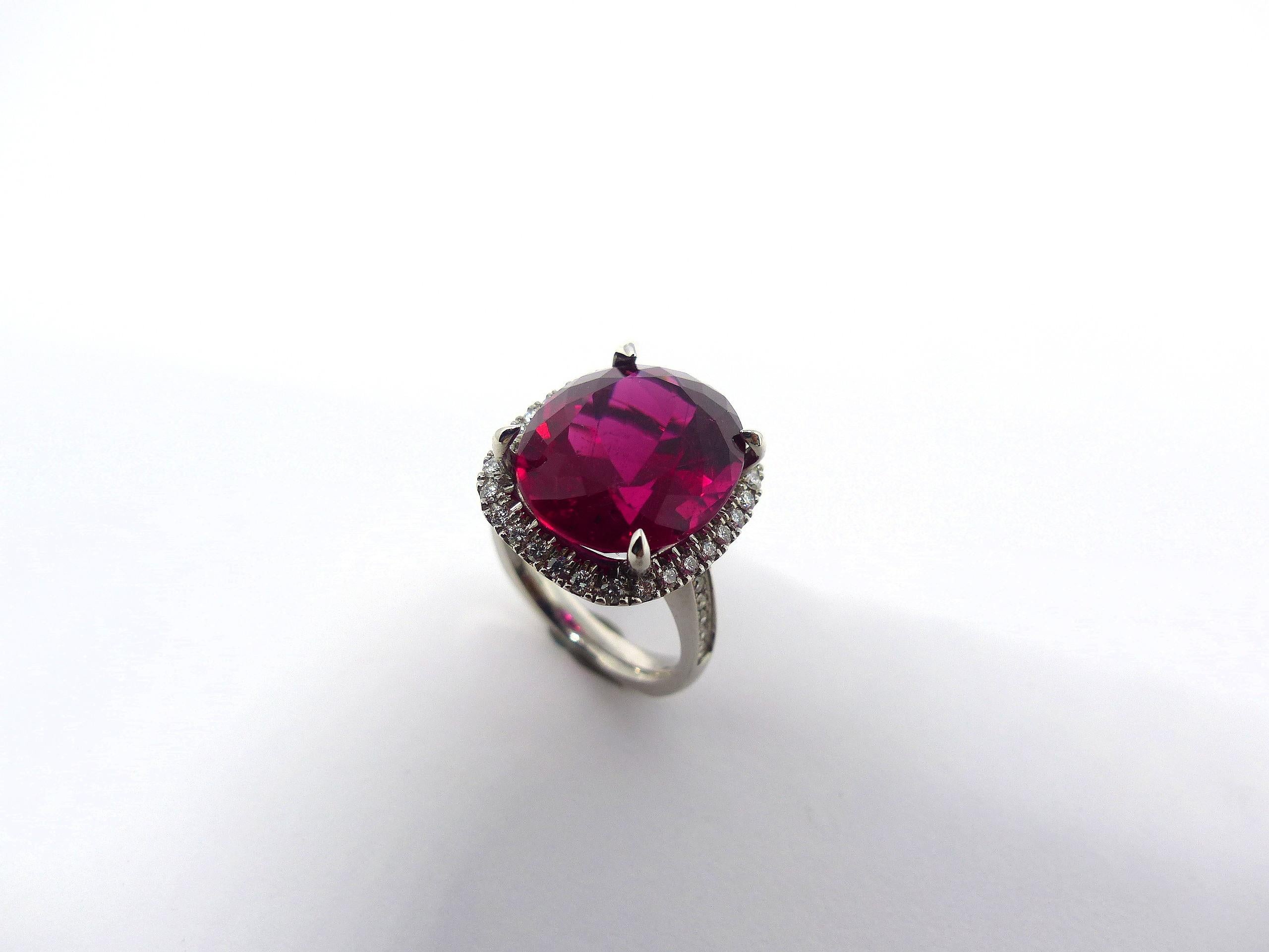 Thomas Leyser is renowned for his contemporary jewellery designs utilizing fine gemstones.

This 18k white gold (10.85g) ring is set with 1x fine Rubellite in magnificient intensiv red colour (cushion 16.5x14mm, 12.90ct) + 42 Diamonds G/VS