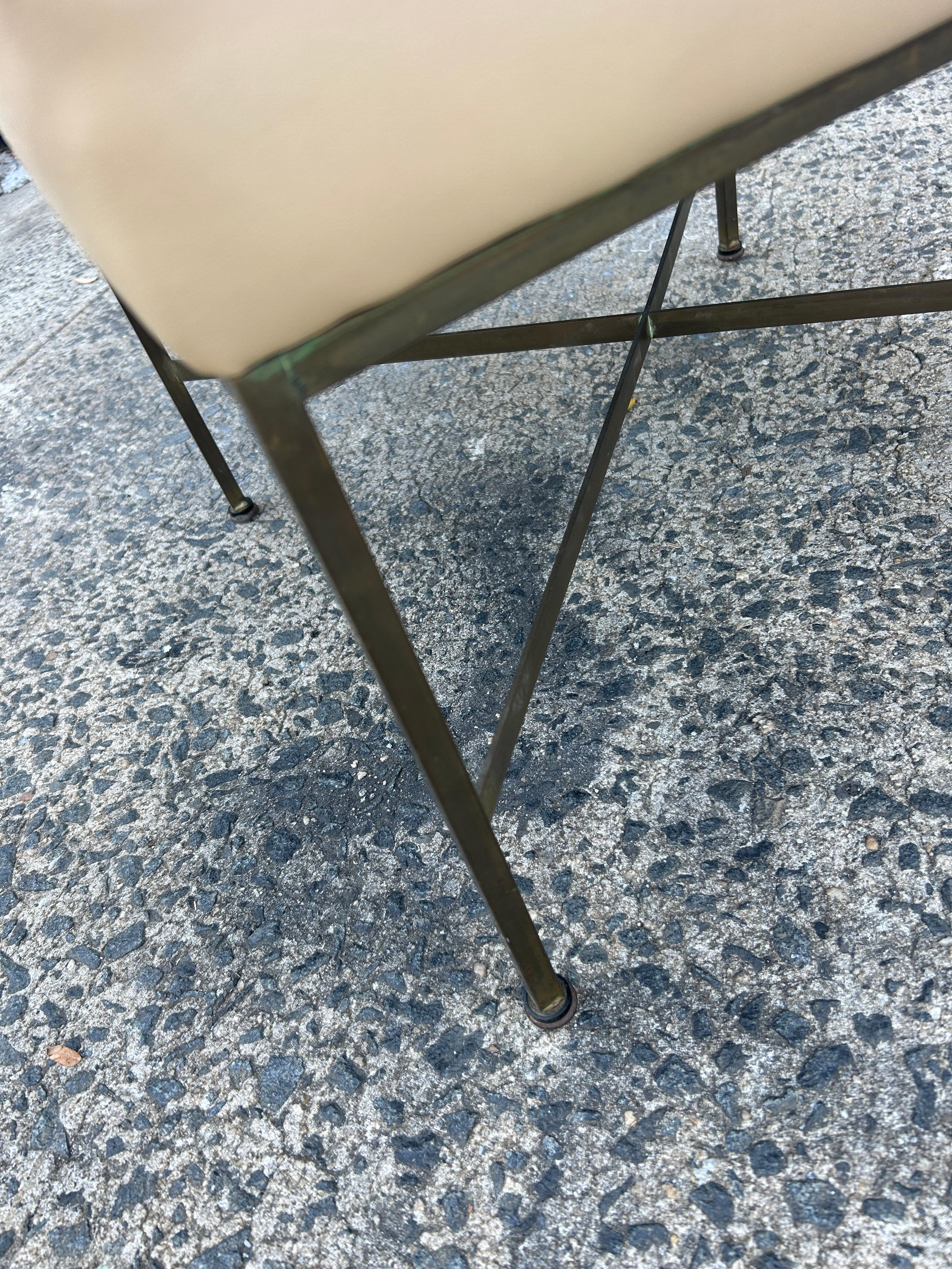 (1) Midcentury Tan leather Paul McCobb Calvin Brass X Base stool In Good Condition For Sale In Brooklyn, NY