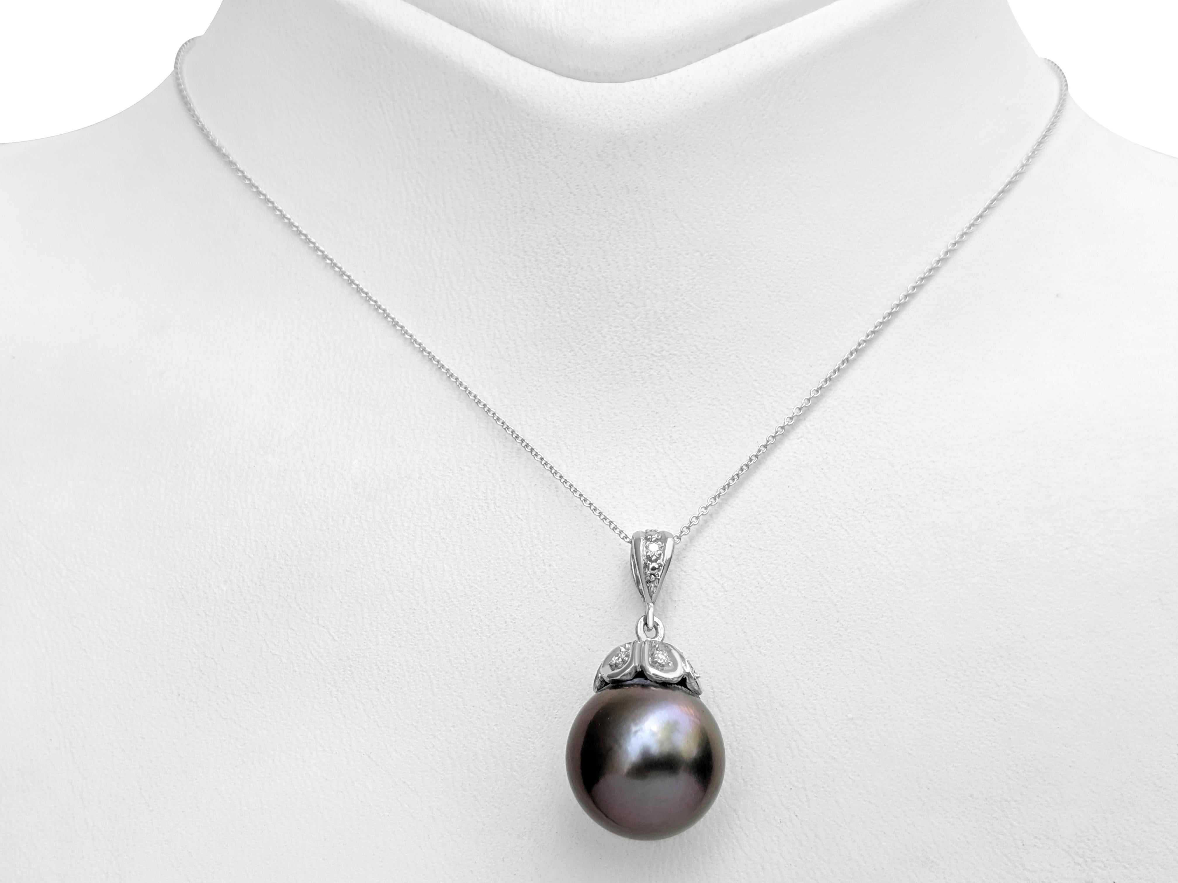 Center Cultured Pearl:
Size: 13.71-13.75MM
Color: Aubergine
Shape: Round Bead
Cultured Water Pearl

Side Stones Diamonds:
0.08 cttw, E-F, VS2-SI1 Natural Diamonds


Item ships from Israeli Diamonds Exchange, customers are responsible for any local