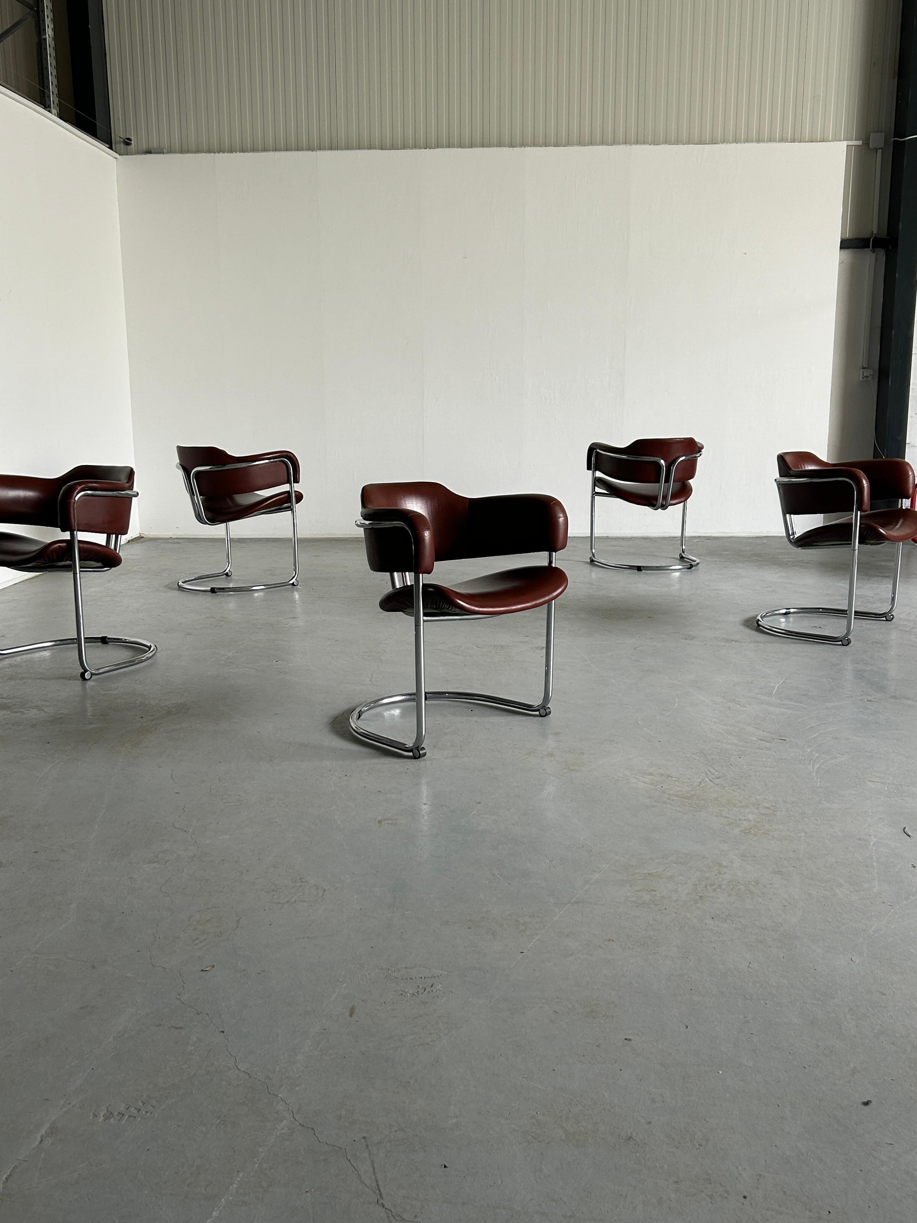 Twelve high-end executive Bauhaus design cantilever armchairs, in style of Vittorio Introini for Mario Sabot.
Thick dark brown faux leather and chromed tubular steel construction.
High-quality Italian production of the 1980s.
Can be used as dining