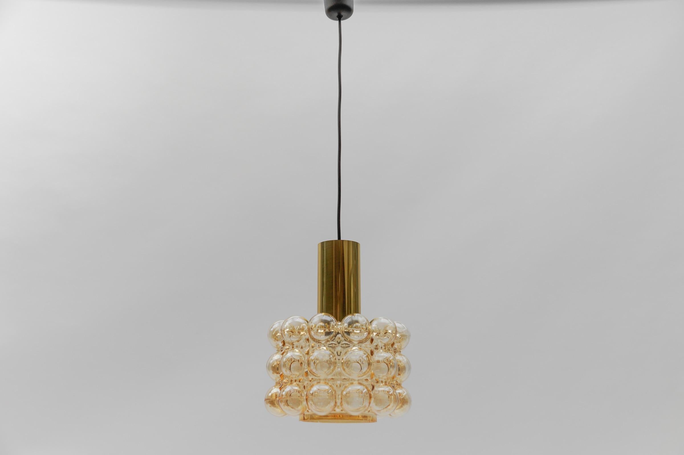 1 of 2 Amber Bubble Glass Ceiling Lamp by Helena Tynell for Limburg, Germany 1960s

Dimensions
Height: 33.46 in. (85 cm)
Diameter: 10.23 in. (26 cm)

The fixture need 1 x E27 standard bulb with 60W max.

Light bulbs are not included. 
It is possible
