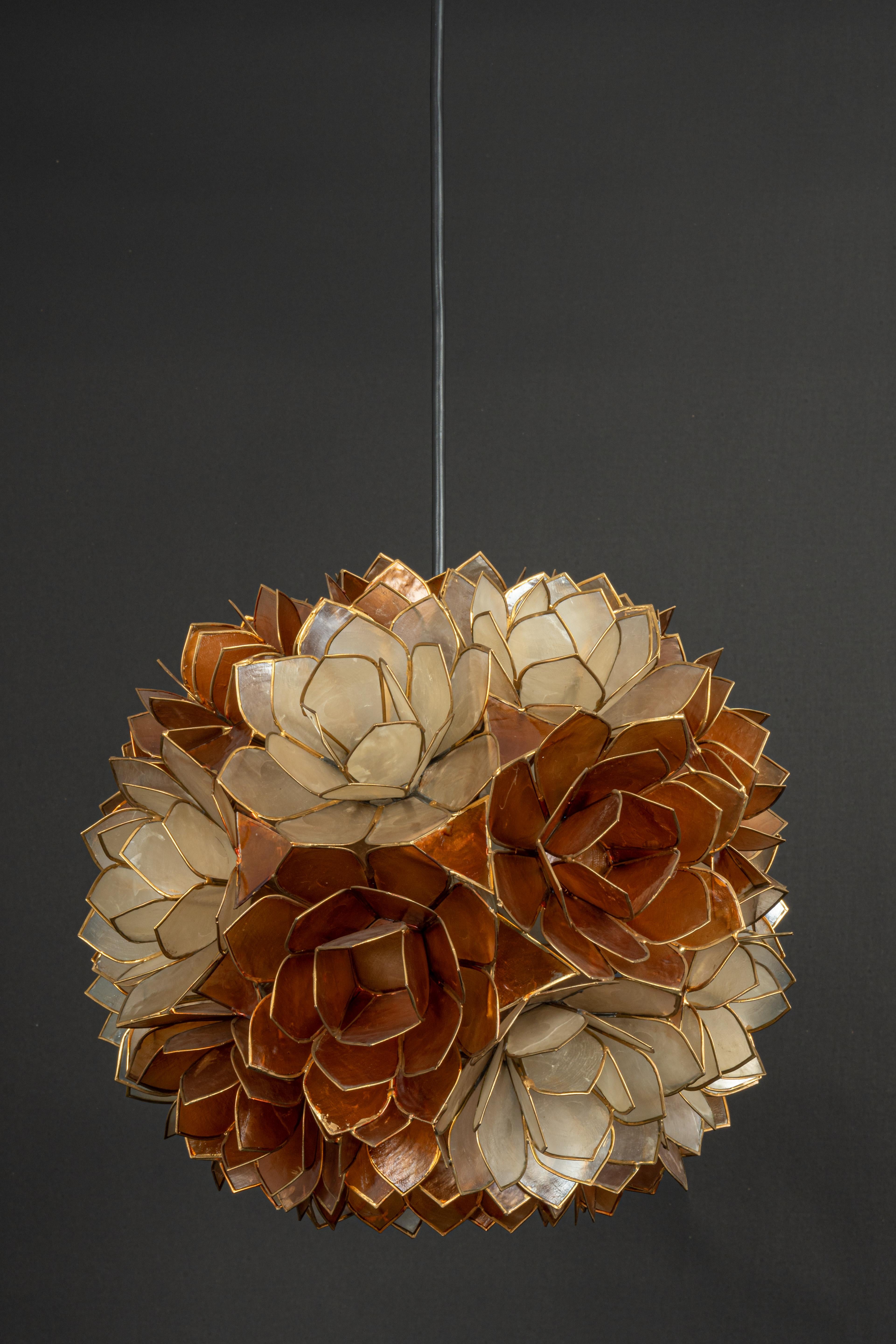 Stunning Capiz shell lotus ball chandelier pendant light Germany, 1960s

It requires 1 x E27 standard bulbs with 100W max each.
A light bulb is not included. It is possible to install this fixture in all countries (US, UK, Europe, Asia,