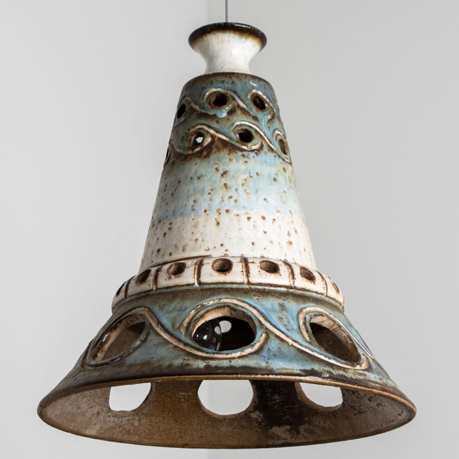 Playful arrangement of stunning round hanging lamps with an unusual shape, made with rich terra colored brown ceramics, manufactured in the 1970s in Denmark. We have a multitude of unique colored ceramic light sets and arrangements, all available in