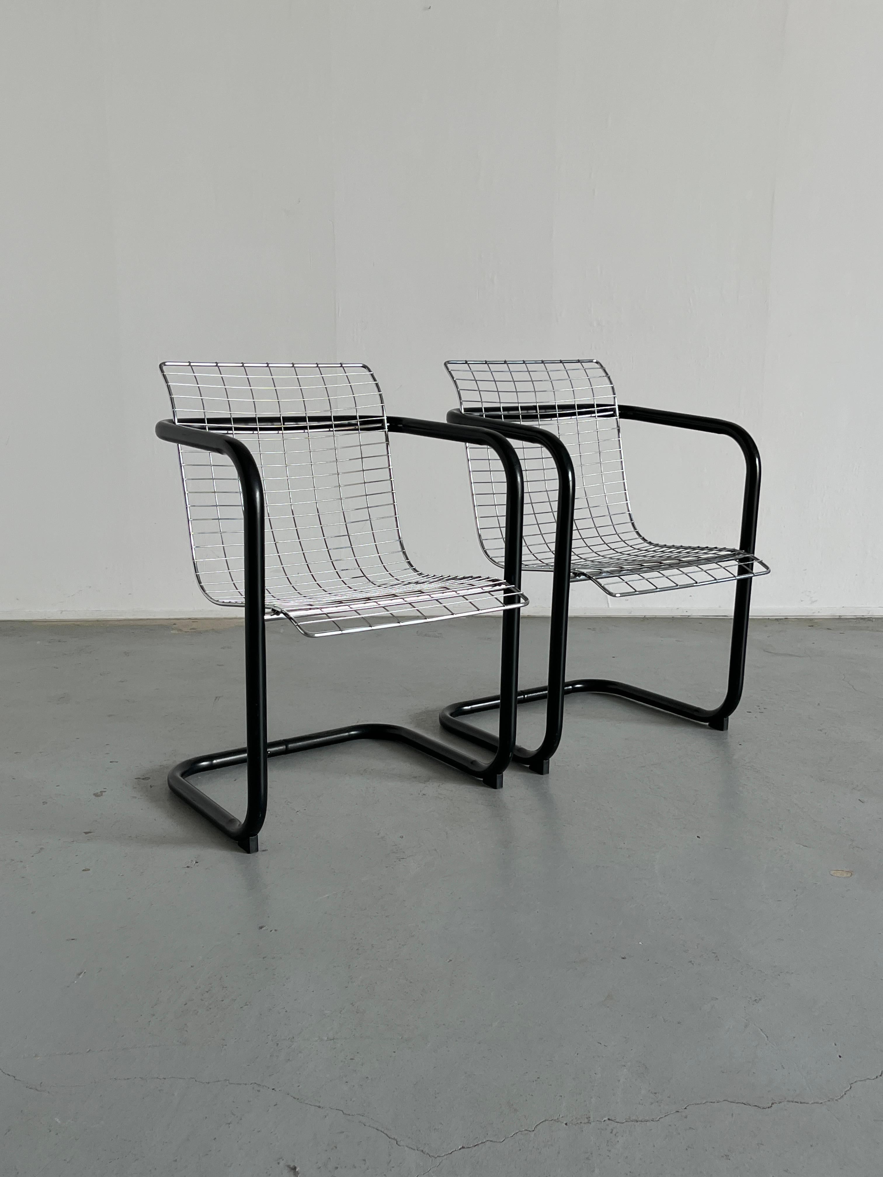 Two industrial club chairs formed out of a black tubular metal frame and a chromed wire seat/backrest. An original 1980s Italian production.

In good vintage condition with expected signs of age and use, mostly surface scratches.

Sold per