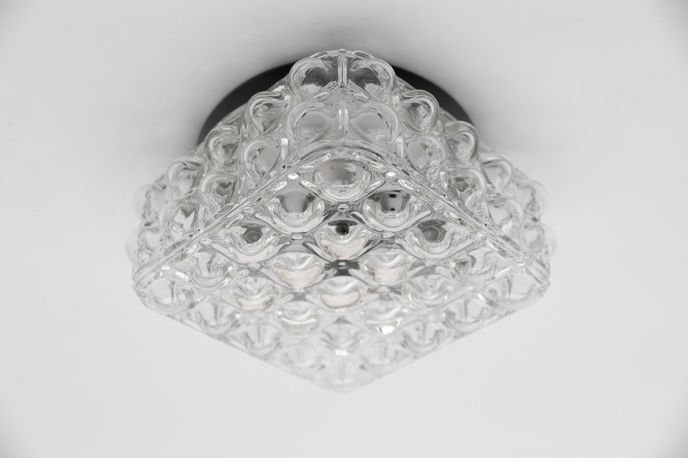 1 of 2 Clear Bubble Glass Flush Mount Lamp by Helena Tynell, Germany 1960s

Dimensions
Height: 4.52 in. (11.5 cm)
Width: 8.26 in. (21 cm)
Depth: 8.26 in. (21 cm)

The fixture need 1 x E27 standard bulb with 60W max.

Light bulbs are not