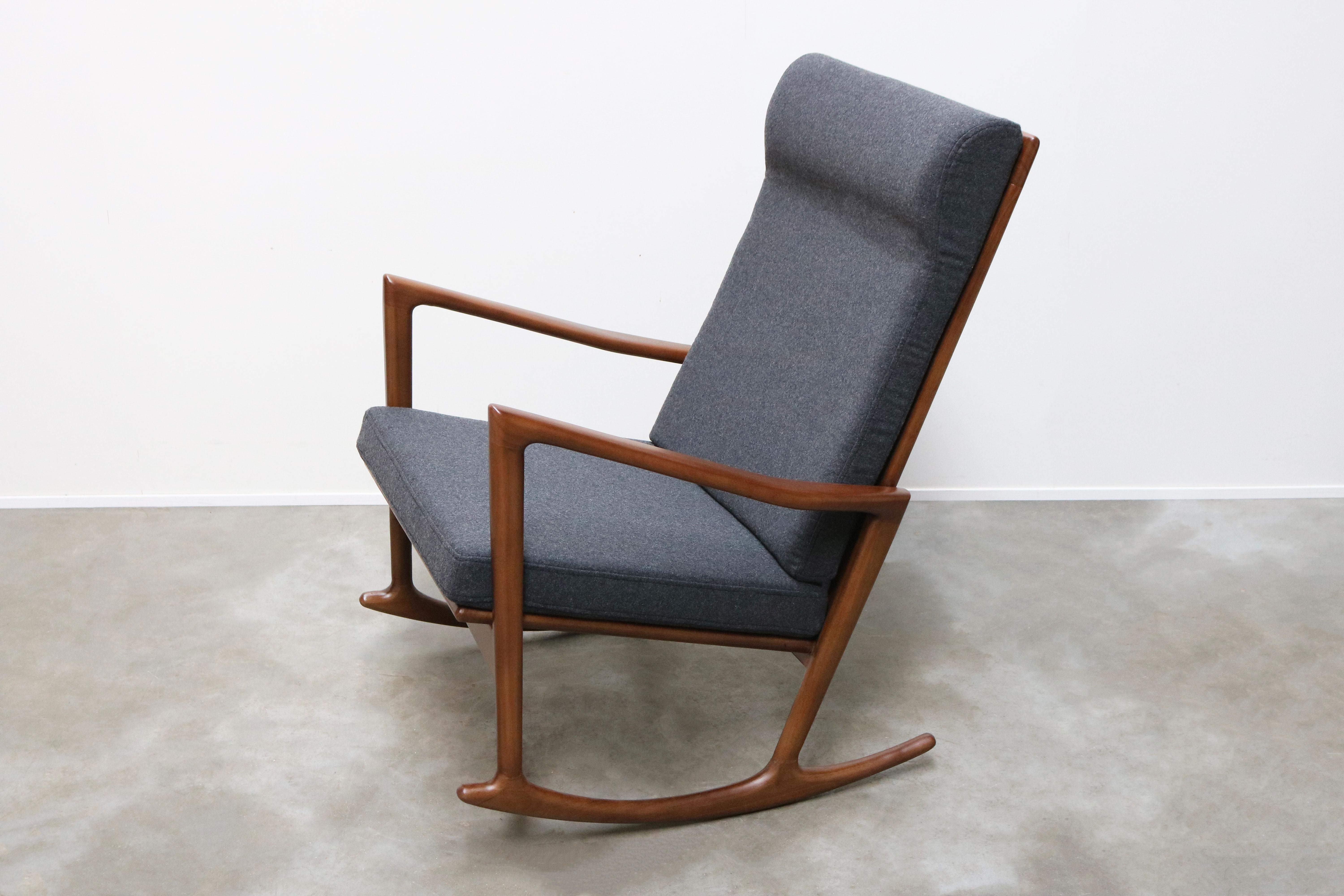 From our own workshop & design collection this gorgeous 1950 danish design style rocking chair 
Made out of solid walnut with a grey/blue cashmere upholstery. The rocking chair looks amazing and is most comfortable 
Great as a statement piece