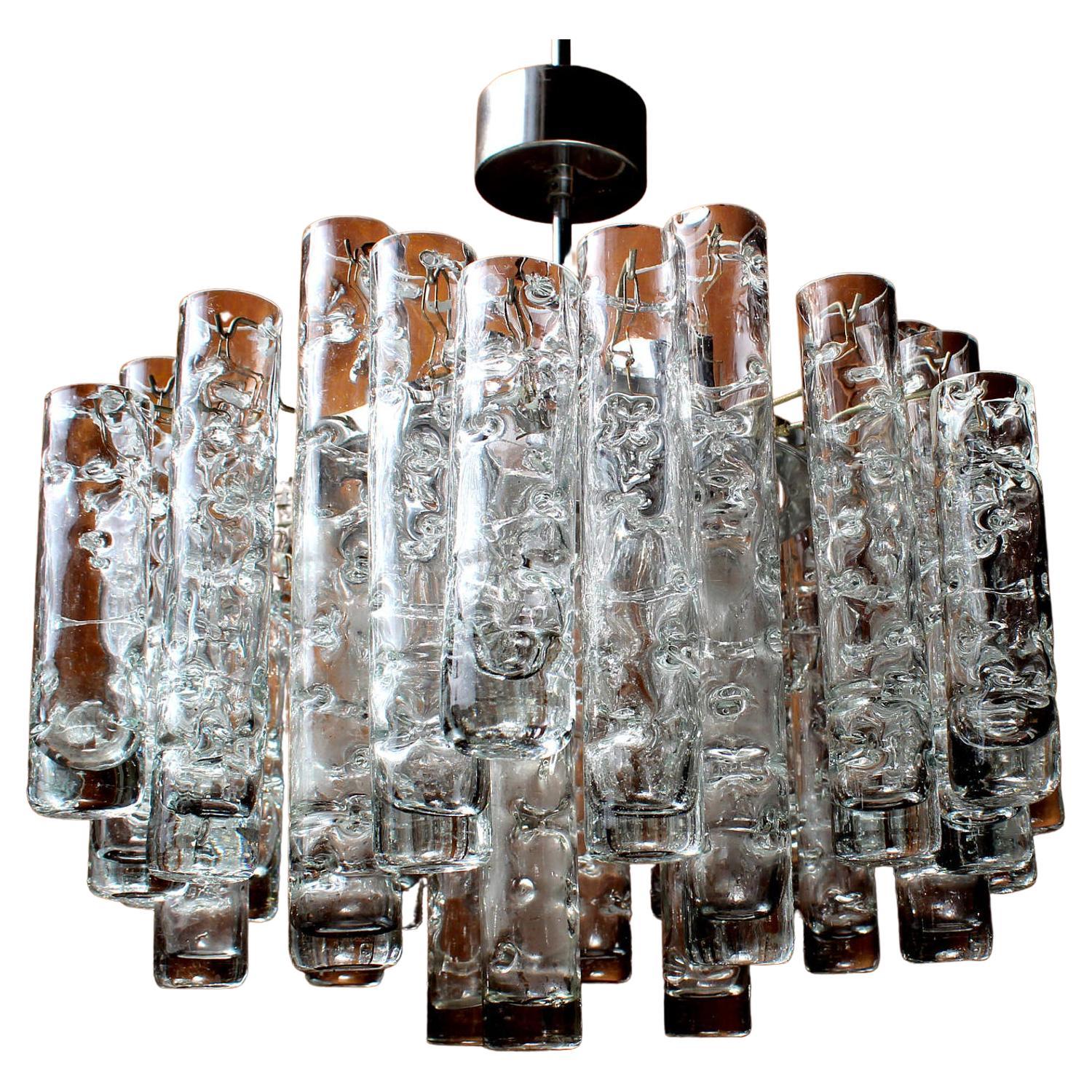 Heavy doria fürth crystal glass chandelier.

3 Lights & 31 grand hand-made glass tubes.

Measures: diameter 18 inches original height 33 inches

1 of 2 Elegant 3 lights (e27) fine crystal chandelier 1970´s / Doria / Fürth / Germany.

This
