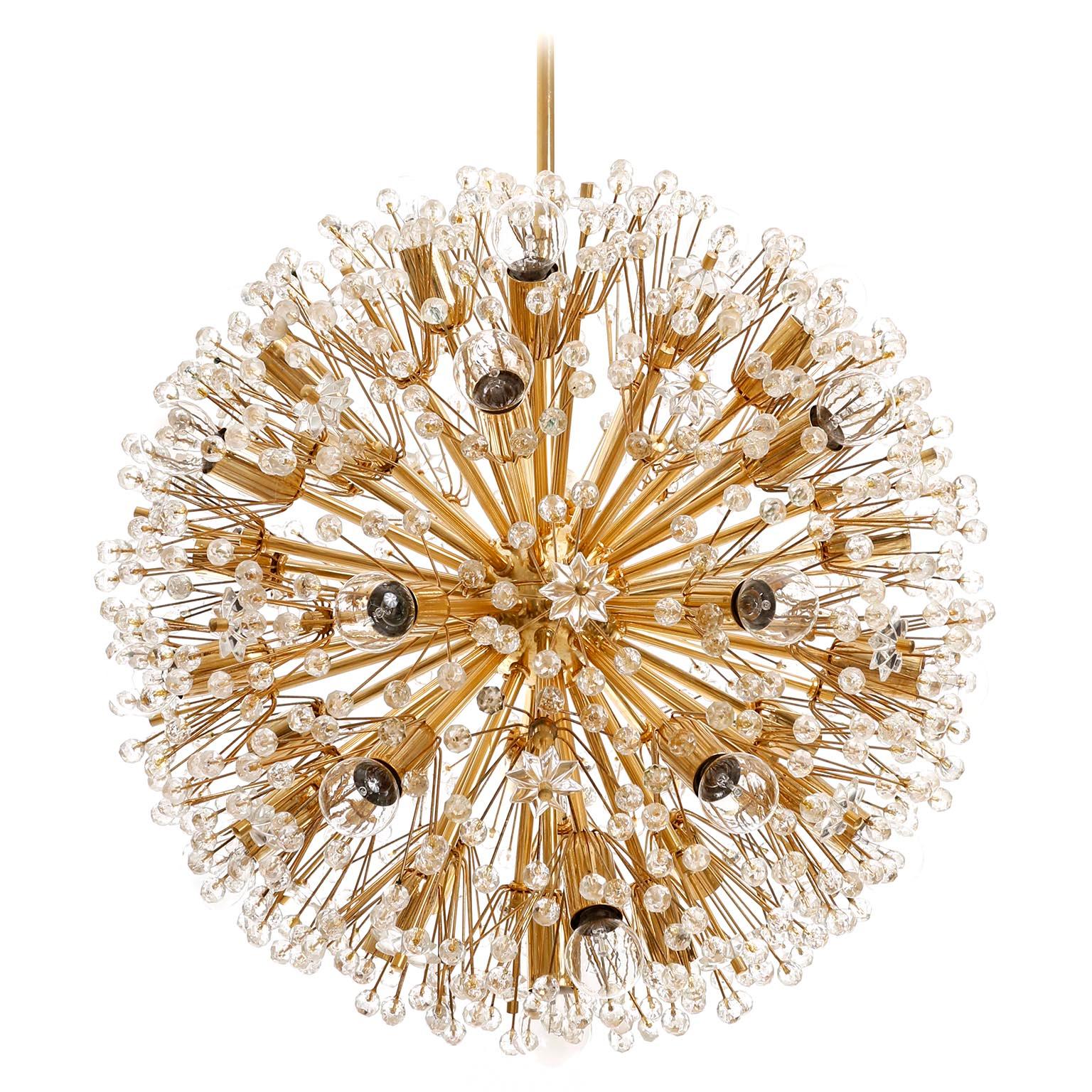 One of two large Sputnik chandeliers designed by Emil Stejnar and manufactured in midcentury, circa 1970.
This beautiful light fixture is made of a 24-carat gold-plated brass frame which is decorated with cut glass in the form of beads and stars.