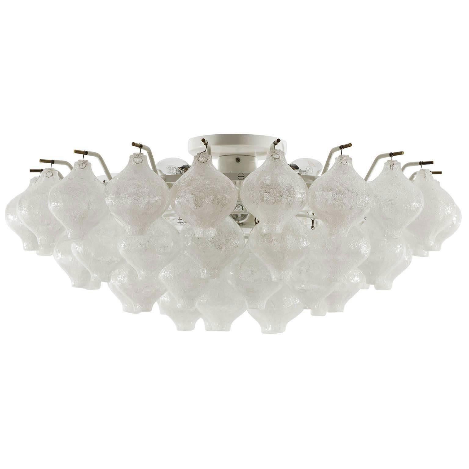 One of two extra large and gorgeous Mid-Century Modern 'Tulipan' flush mount chandeliers by J.T. Kalmar, Austria, Vienna, manufactured in midcentury, circa 1970 (late 1960s or early 1970s).
The name Tulipan derives from the tulip shaped hand blown