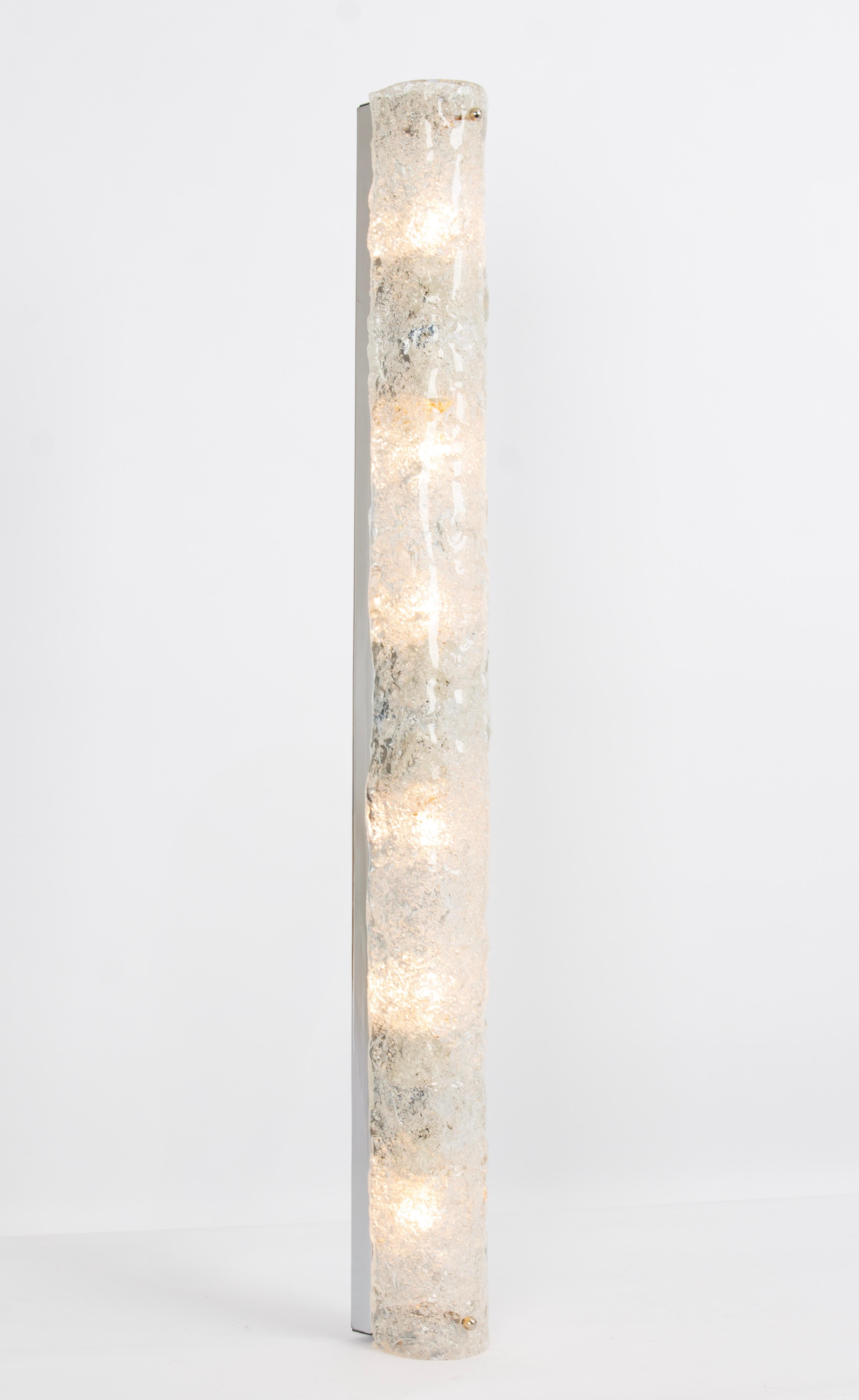 1 of 4 extra large handcrafted Murano glass on a chromed base Sconces, by Hillebrand, Germany, circa 1960s.

Each item consists of textured quality clear crystal tubular shade simulating ice on chrome frame.

The design allows this light to be