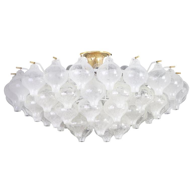 Wonderful onion shaped Tulipan glass chandelier. 50 hand-blown glasses suspended on white painted metal frame.
Best of design from the 1960s by Kalmar, Austria. High quality of the materials.

Sockets: The chandelier takes 21 small screw base bulbs