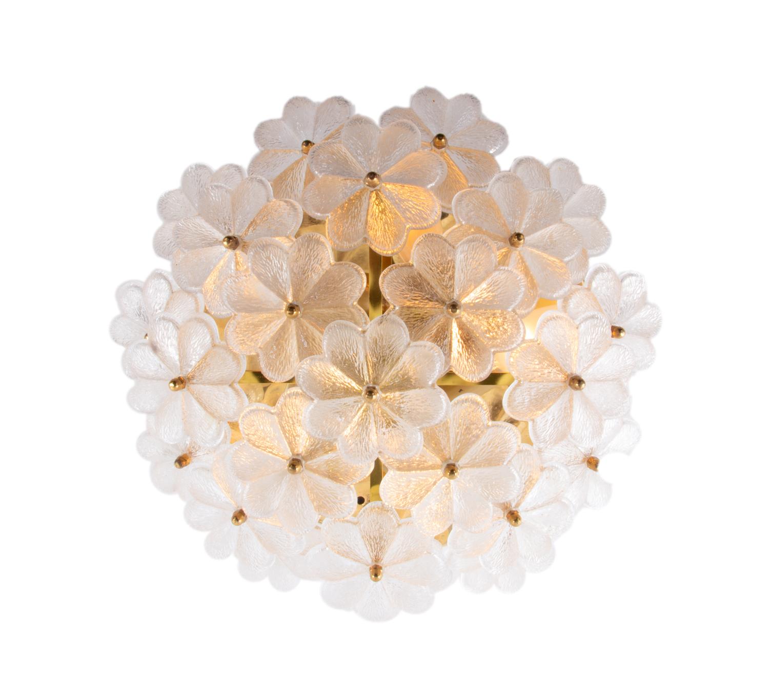 1 of 2 elegant crystal and brass flush mount wall or ceiling lamps with overlapping clear glass flowers manufactured in the 1960s by Palwa (Palme & Walter), Germany.

Design: Ernst Palme. 
Measures: diameter appr. 14