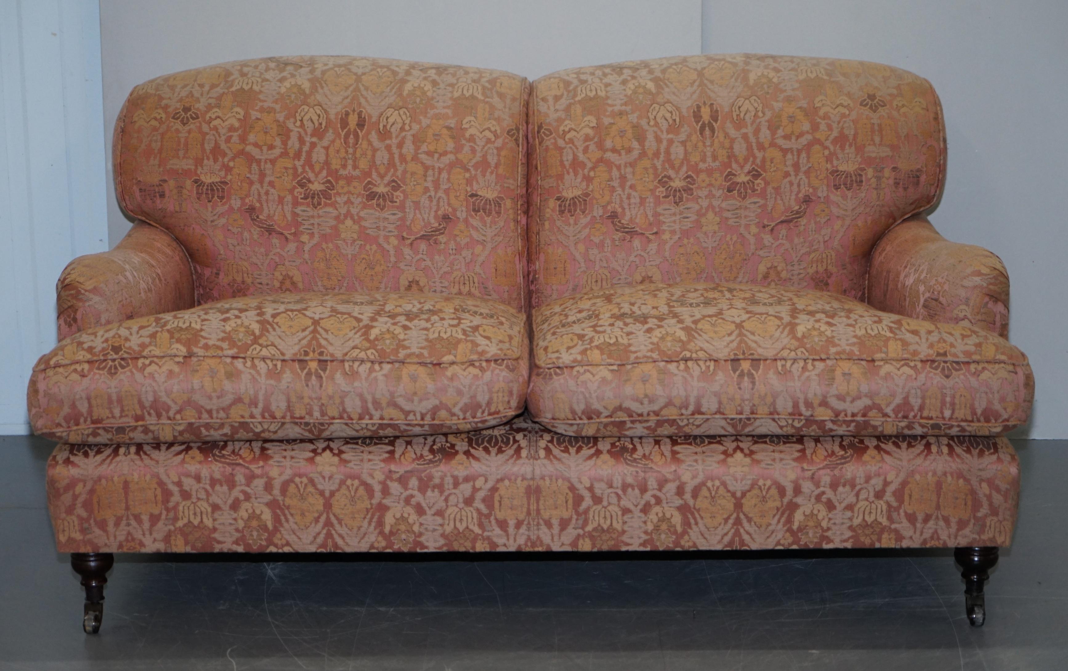 We are delighted to offer for sale this lovely George Smith signature scroll arm sofa RRP £11,000 with faded salmon pink embroidered upholstery of birds and flowers 

George Smith Chelsea make some of the finest handmade in England sofas based on