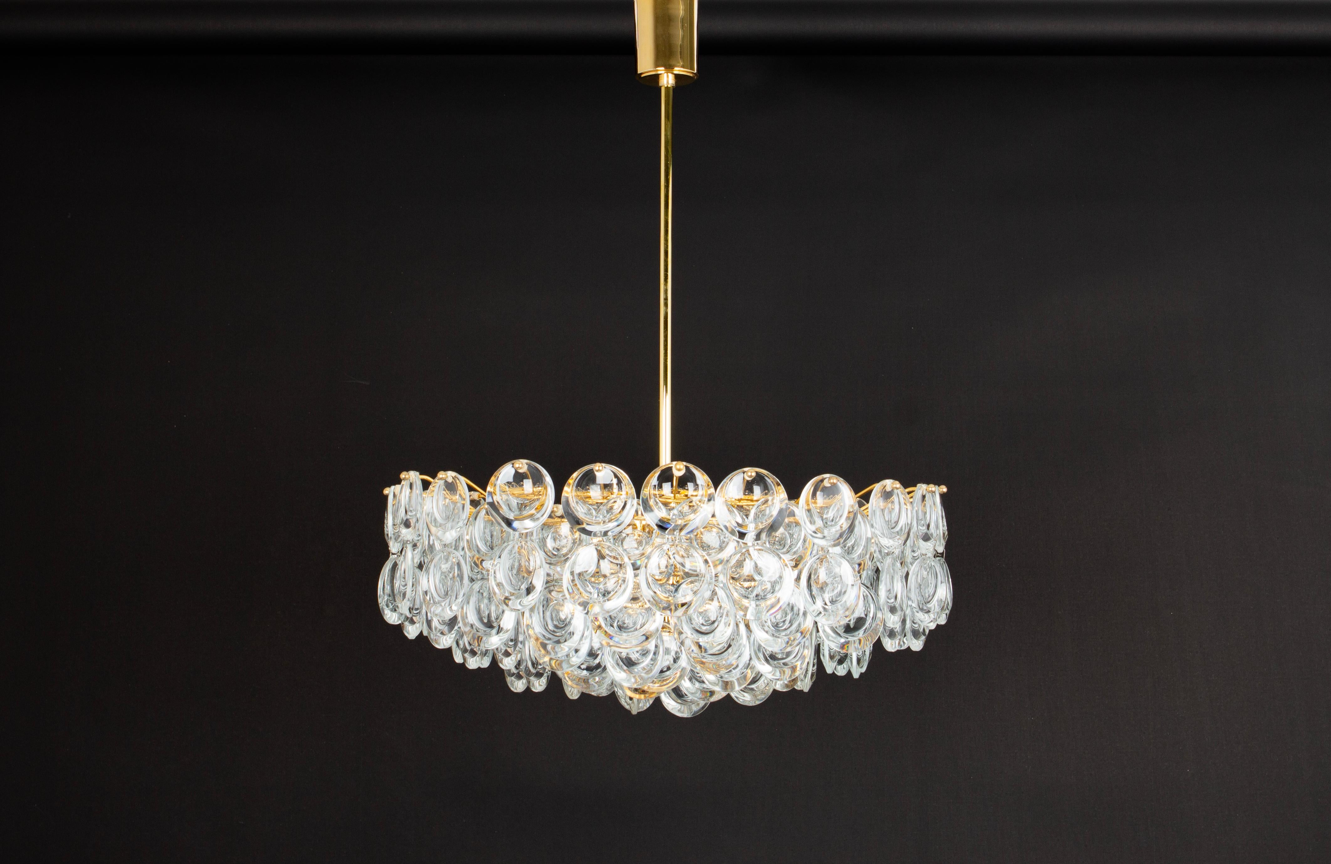 Delicate floral chandelier with crystal glass and gilded brass parts made by Palwa, Sciolari Design Germany, 1970s. Featuring a multitude of crystal glasses.
Measures: Diameter 19.8