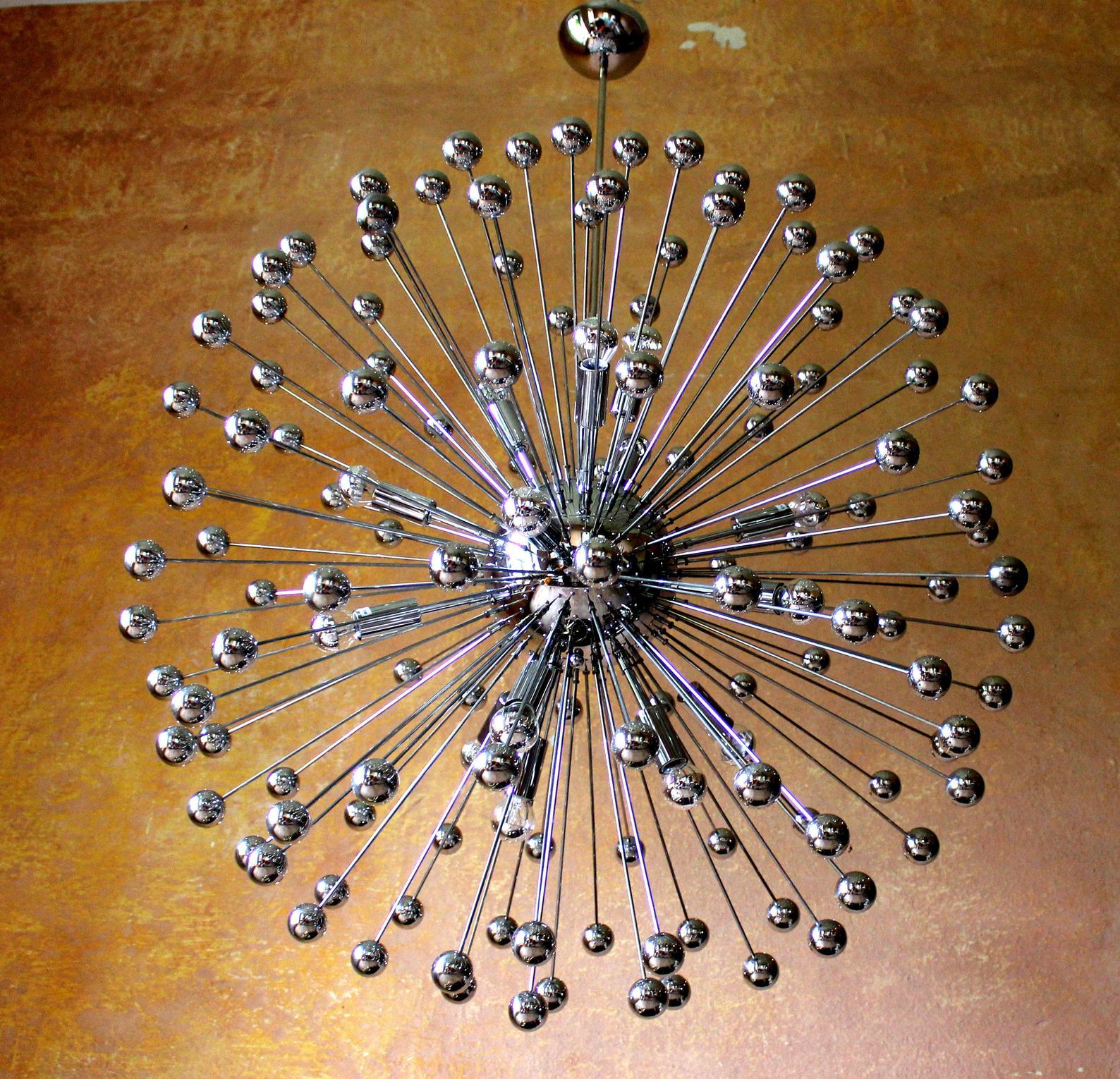15 lights concert hall chandelier 1970s with chromed and mirrored elements

Measures: Diameter 3.2 feet/ 95cm original total height 4.6 feet/ 136cm

1 of 2 large 15 lights (E14) sputnik chandelier atomic design, 1960s-1970s
The piece is