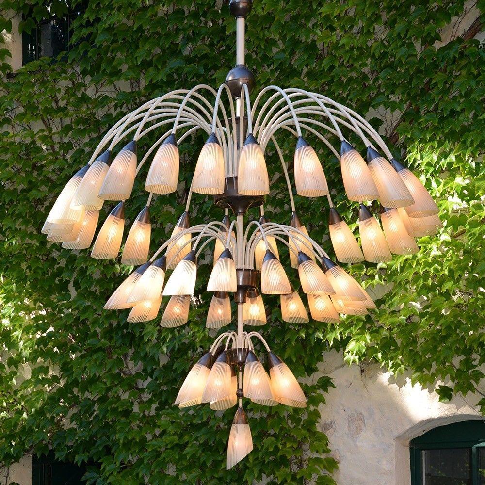Very special 3-row chandelier with 49 model A / E27 bulbs under a glass shade in original excellent condition. The height is including stem to canopy. We can also shorten the lamp to your needs.
Also 15 spare glasses per available. Lamp is newly