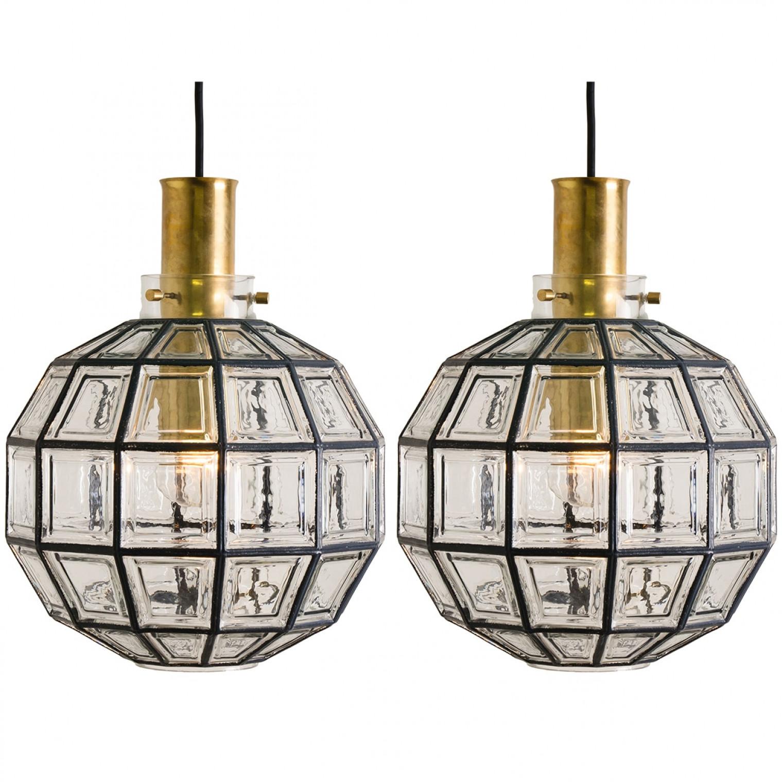 This beautiful set octagonal glass light fixtures were manufactured by Glashütte Limburg in Germany during the 1960s. Beautiful craftsmanship. Each lamp, made from elaborate clear glass, features one E27 socket and brass suspension.

Please note