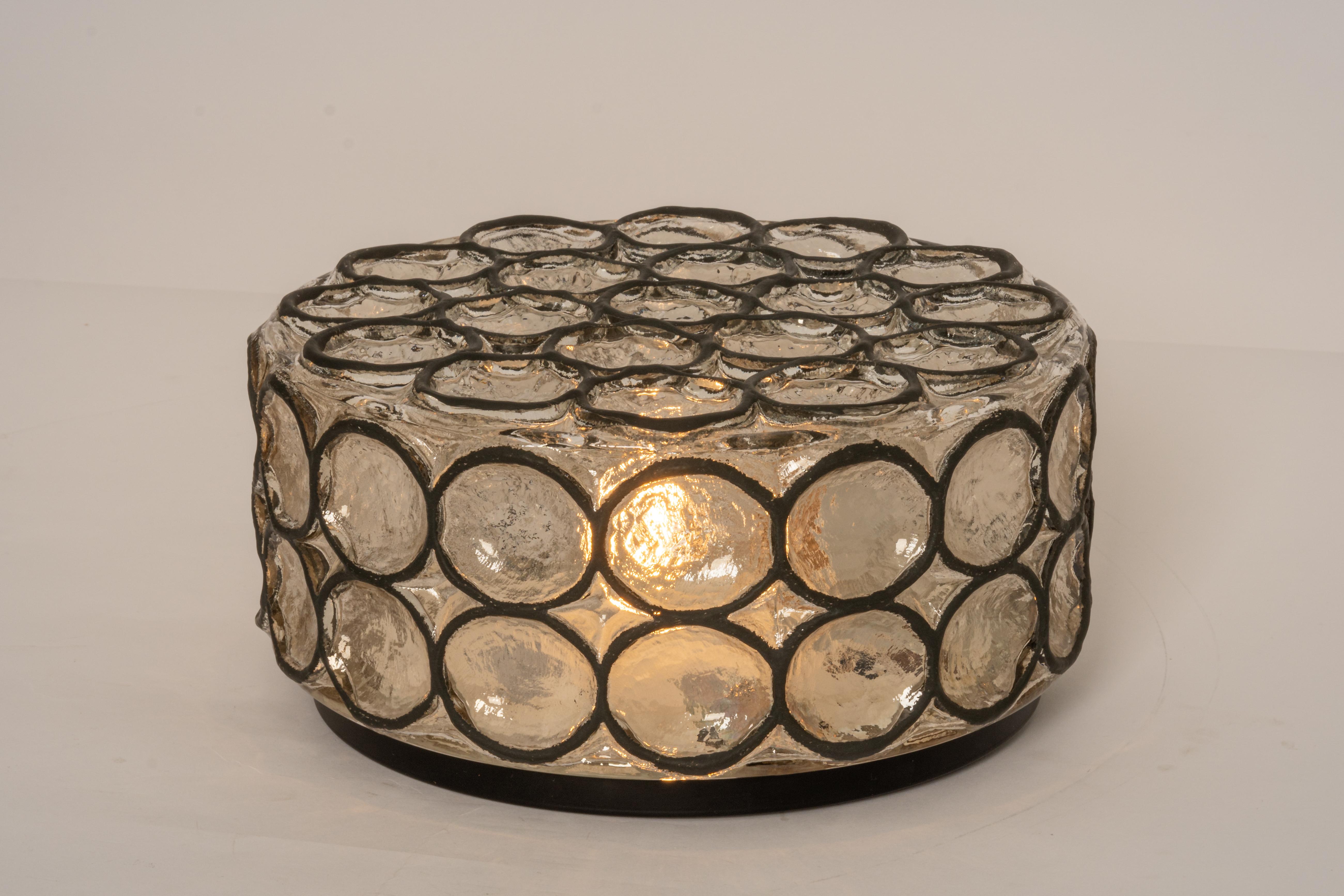 Minimalist iron and clear glass ceiling or wall light manufactured by Limburg Glashütte, Germany, circa 1960-1969.

Heavy quality and in very good condition. Cleaned, well-wired and ready to use.
The fixture requires 1 x E27 standard bulbs with 60 W