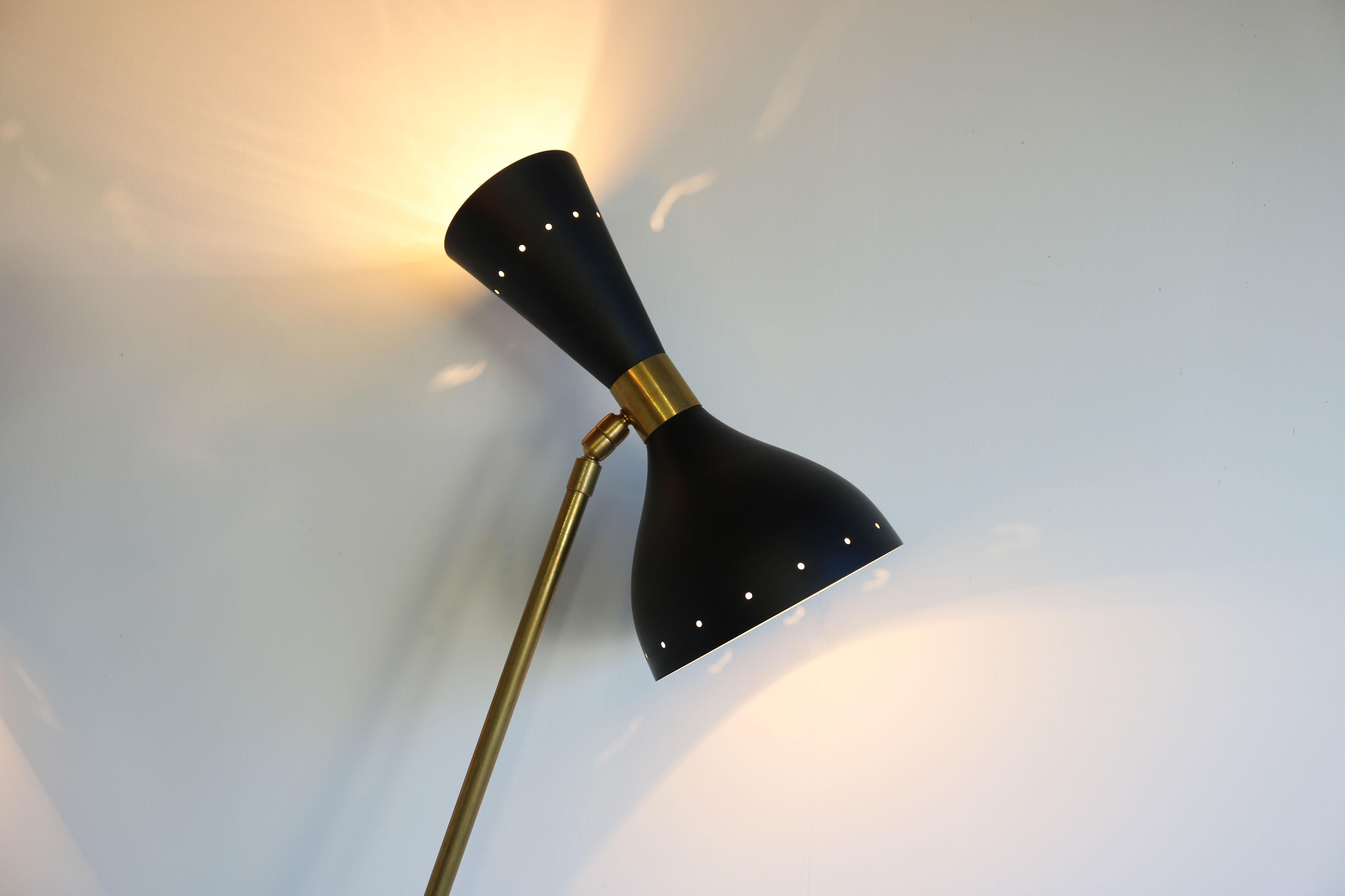 1 of 2 stylish minimalist Italian design floor lamps in the style of Stilnovo 1950. 
The shades can be adjusted to your desired angle. 
Each floor lamp has 6 light sockets, 3 facing down and 3 facing up. 
Rewired and ready for safe use. Slight