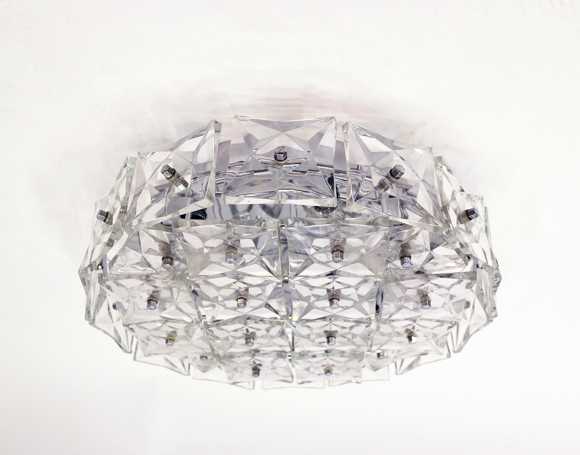 Elegant large chromed flush mount fixture with faceted crystal elements. Manufactured by Kinkeldey, Germany in the 1960s. 

Chandelier illuminates beautifully and offers a lot of light. Gem from the time. With this light you make a clear statement