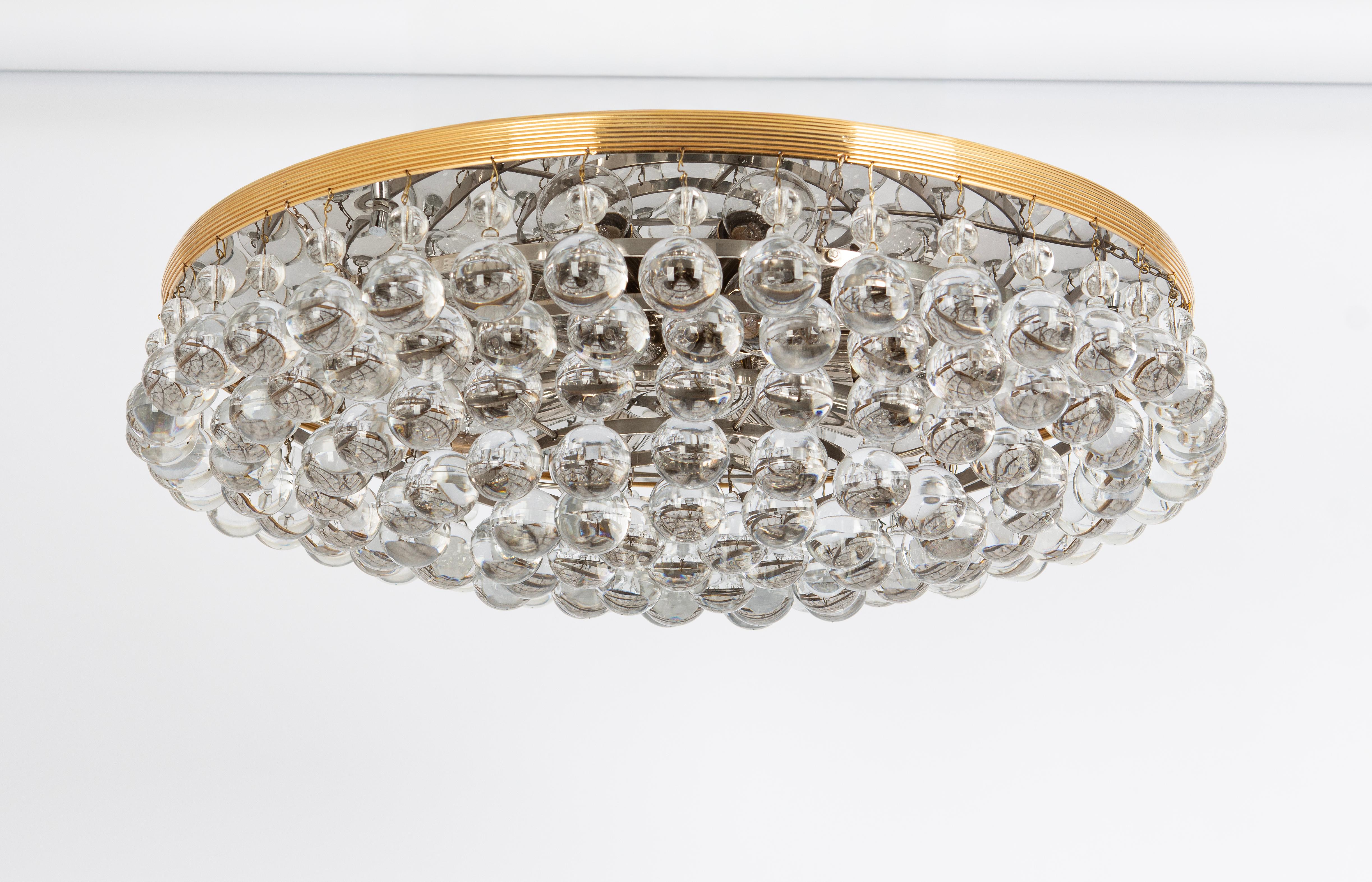 A stunning flush mount by Christoph Palme , Germany, manufactured in 1970s. It’s composed of crystal drop glass pieces on brass / metal frame.
High quality of materials.

Sockets: It needs 8 x E14 base bulbs (max. 40 watt for each).
Light bulbs are