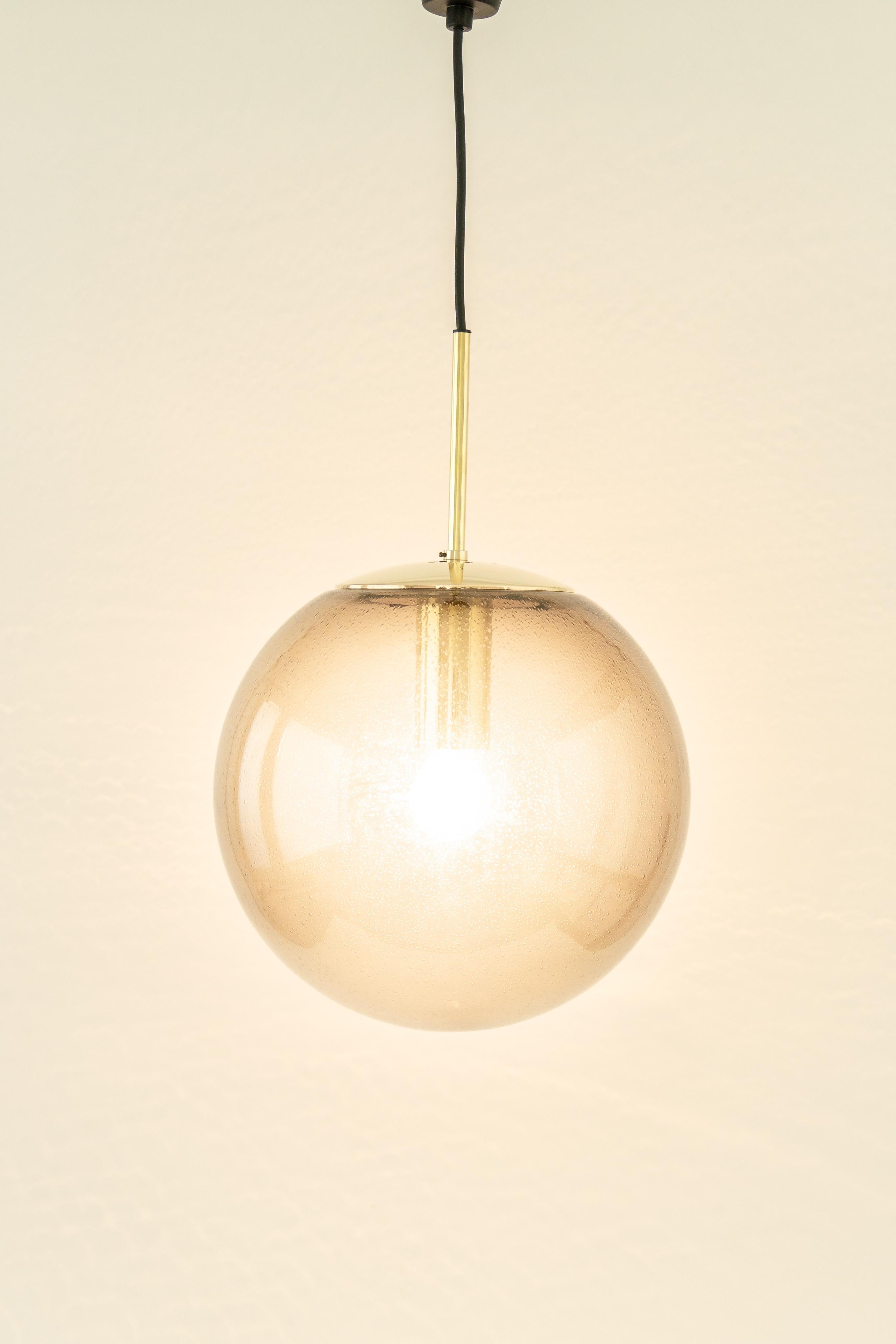 Mid-Century Modern 1 of 2 Large Limburg Brass with Smoked Glass Ball Pendant, Germany, 1970s For Sale