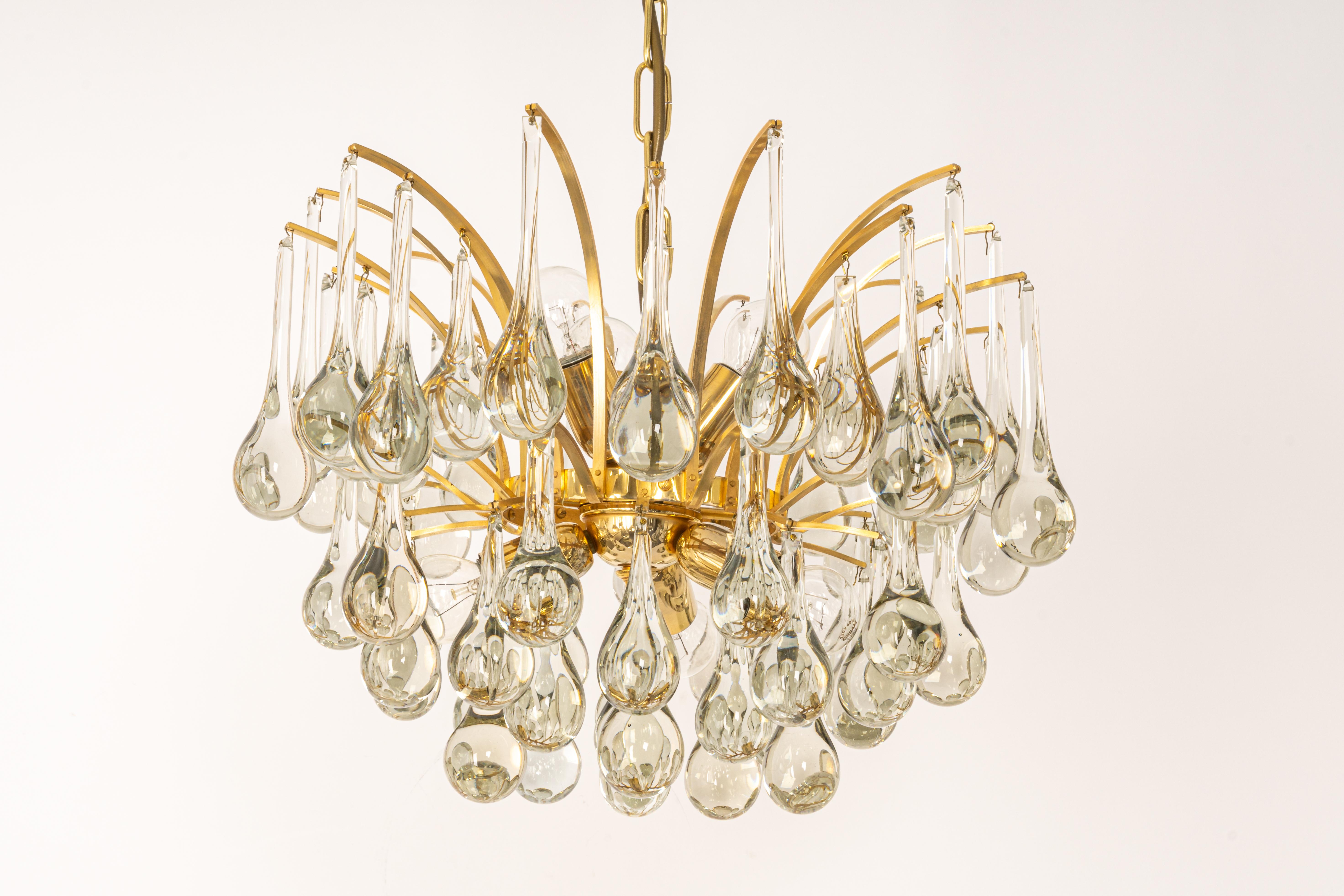 1 of 2 stunning chandelier by Christoph Palme, Germany, manufactured in 1970s. It’s composed of Murano teardrop glass pieces on a gilded brass frame.

High quality and in very good condition. Cleaned, well-wired and ready to use. 

The fixture