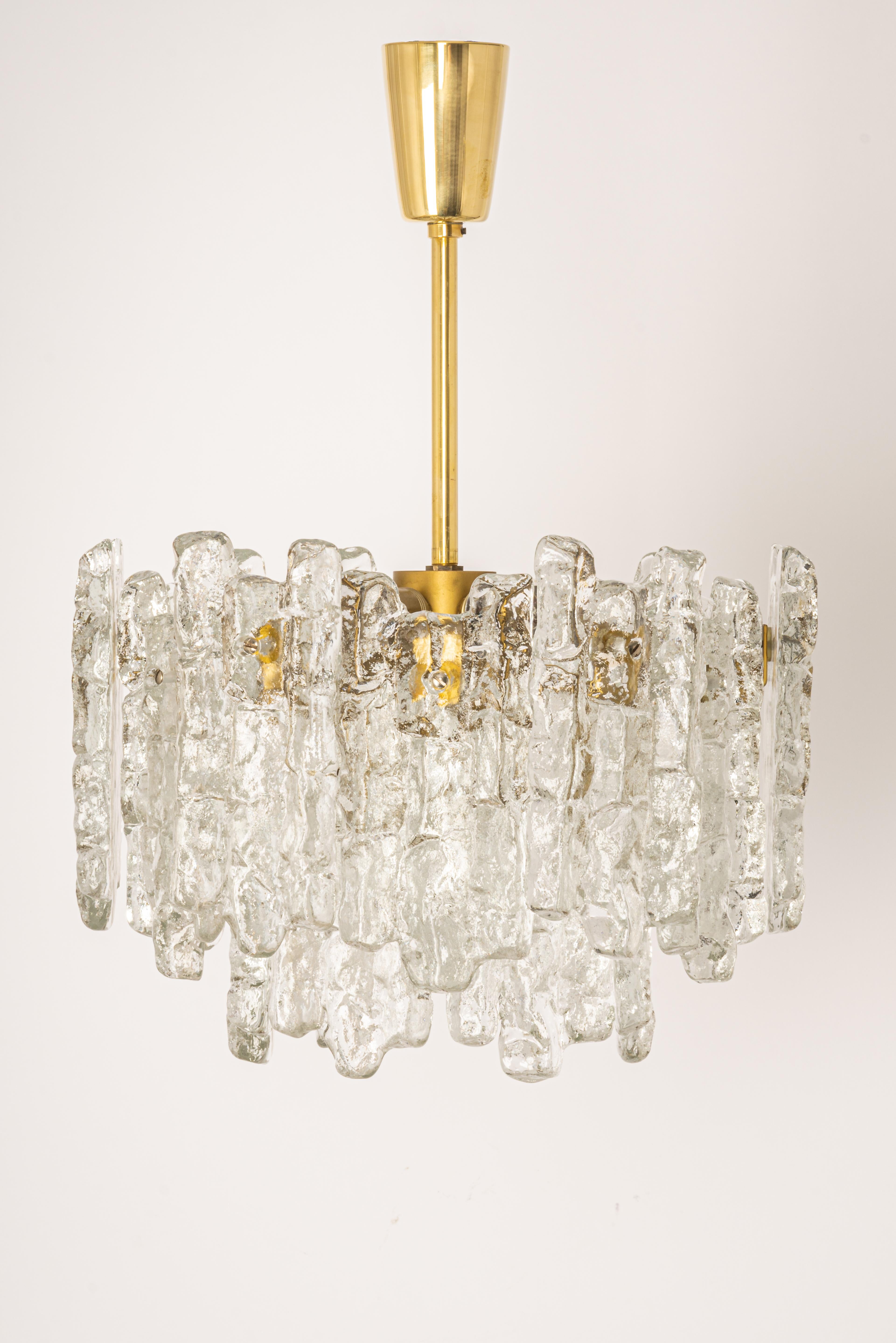 Stunning Murano glass chandelier by Kalmar, 1960s
Two tiers structure gathering 18 structured glasses, beautifully refracting the light very heavy quality.
High quality and in very good condition. Cleaned, well-wired and ready to use.
The fixture