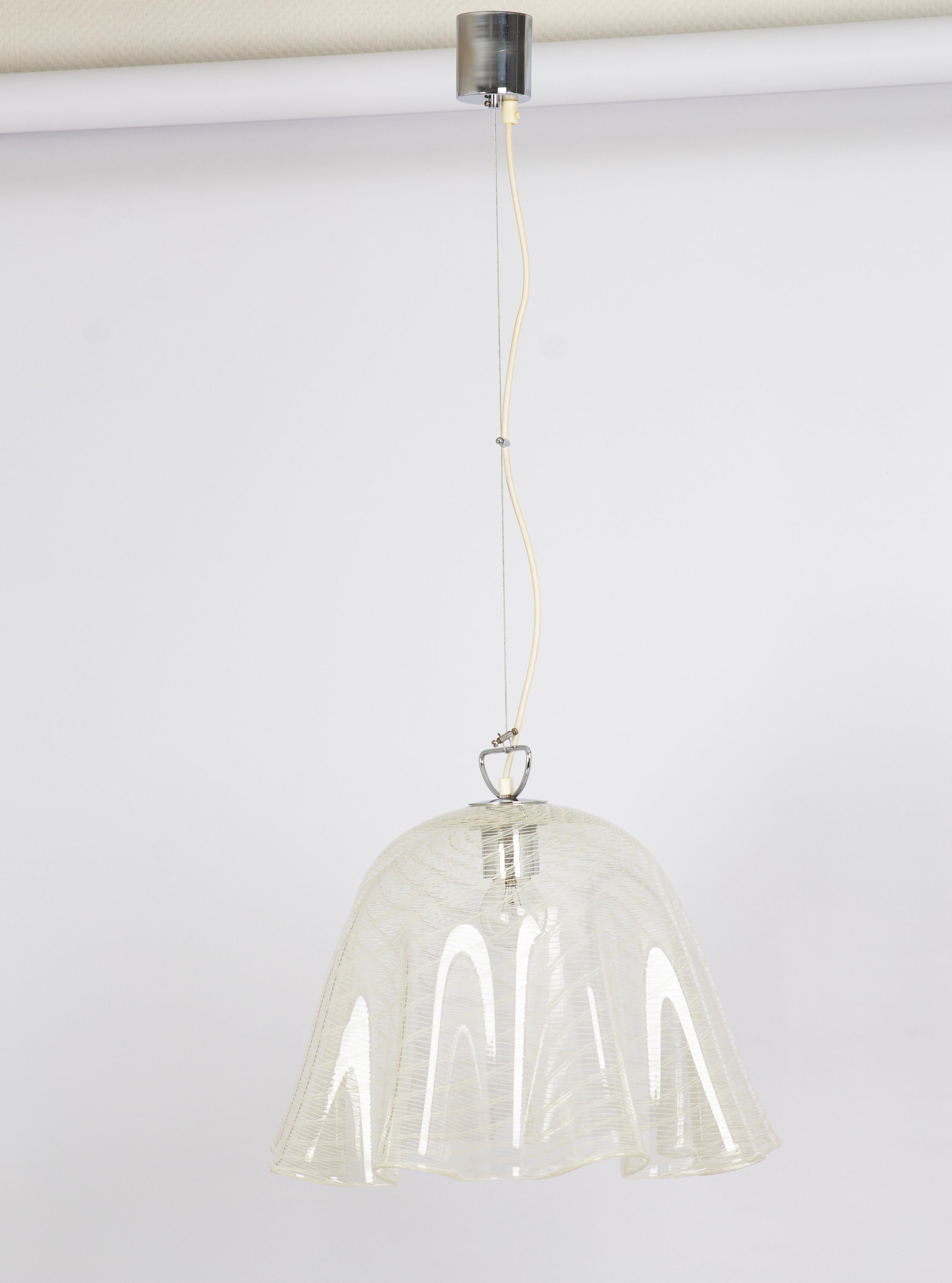 Stunning glass Pendant light by Kalmar -Name of this Serie: Fazzoletto, made in the 1970s
Nice structured glass, beautifully refracting the light.
High quality and in very good condition. Cleaned, well-wired, and ready to use.
The fixture requires 1