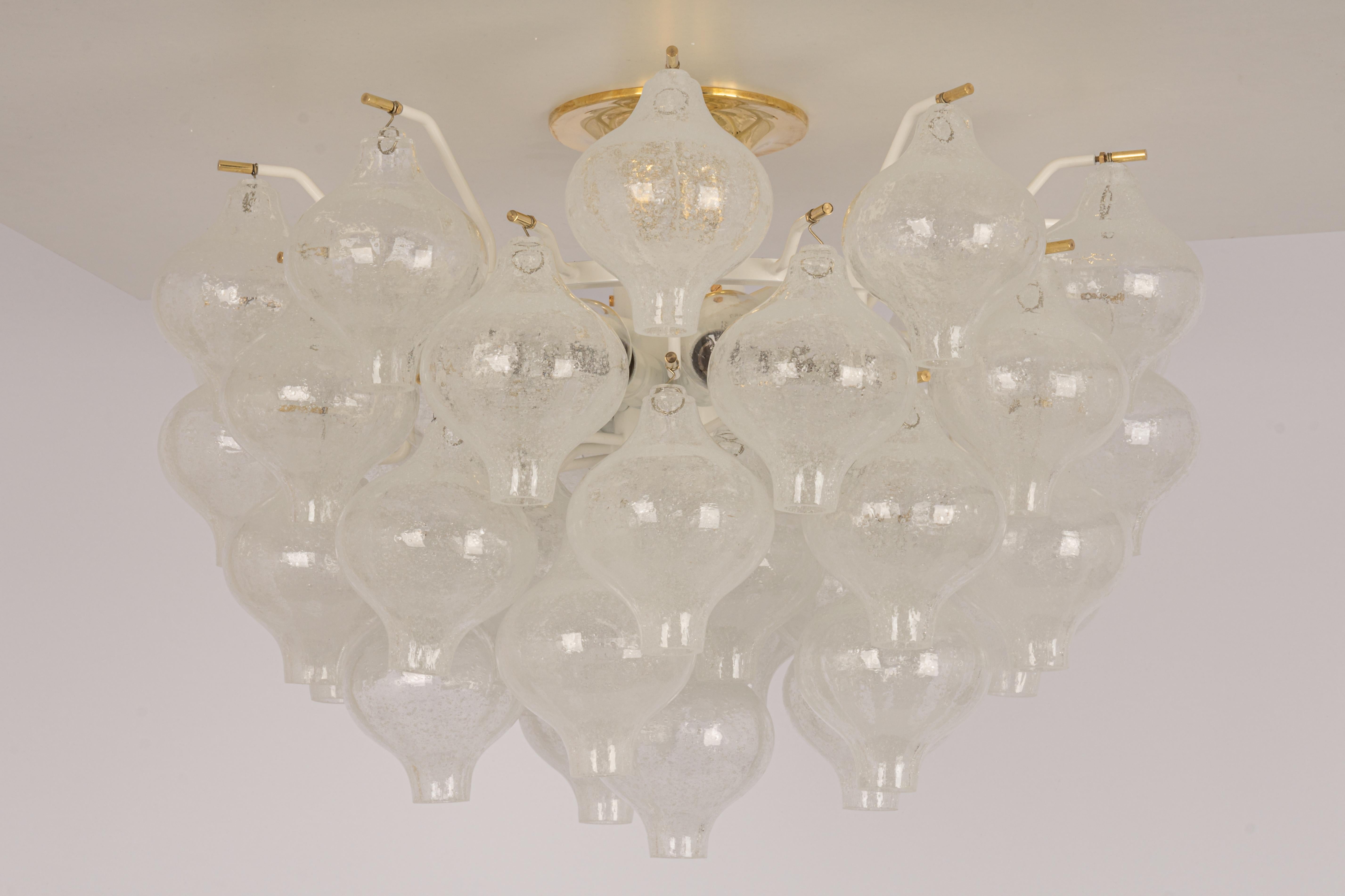 1 of 2 Wonderful onion-shaped -Tulipan glass chandelier or flush mount. A large number of hand-blown glasses were suspended on a white painted metal frame and brass canopy.
Best of design from the 1960s by Kalmar, Austria. High quality of the
