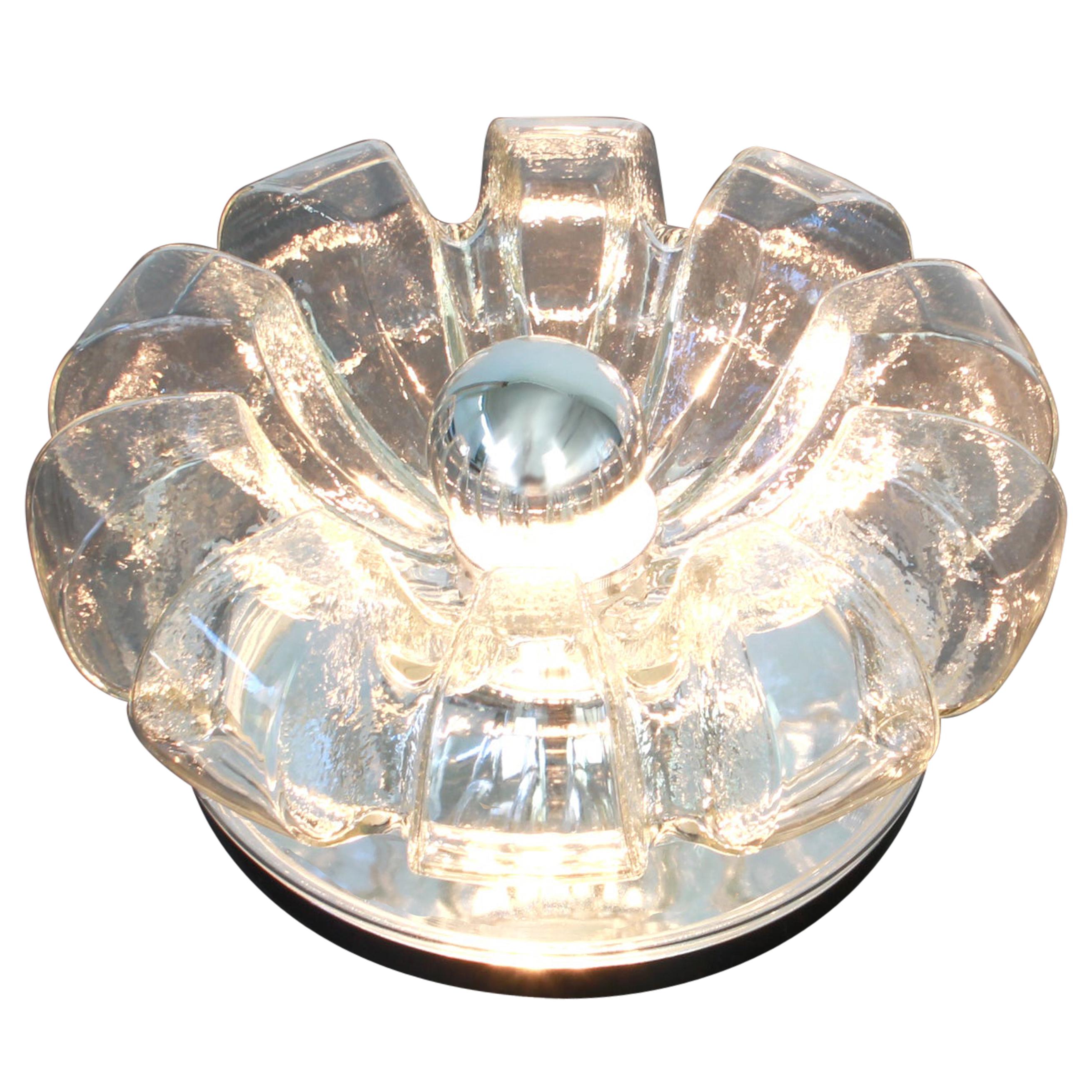 A special round biomorphic clear glass wall sconce or flush mount designed by Koch & Lowy for Peill & Putzler, manufactured in Germany, circa 1970s.

High quality and in very good condition. Cleaned, well-wired and ready to use.

Each fixture