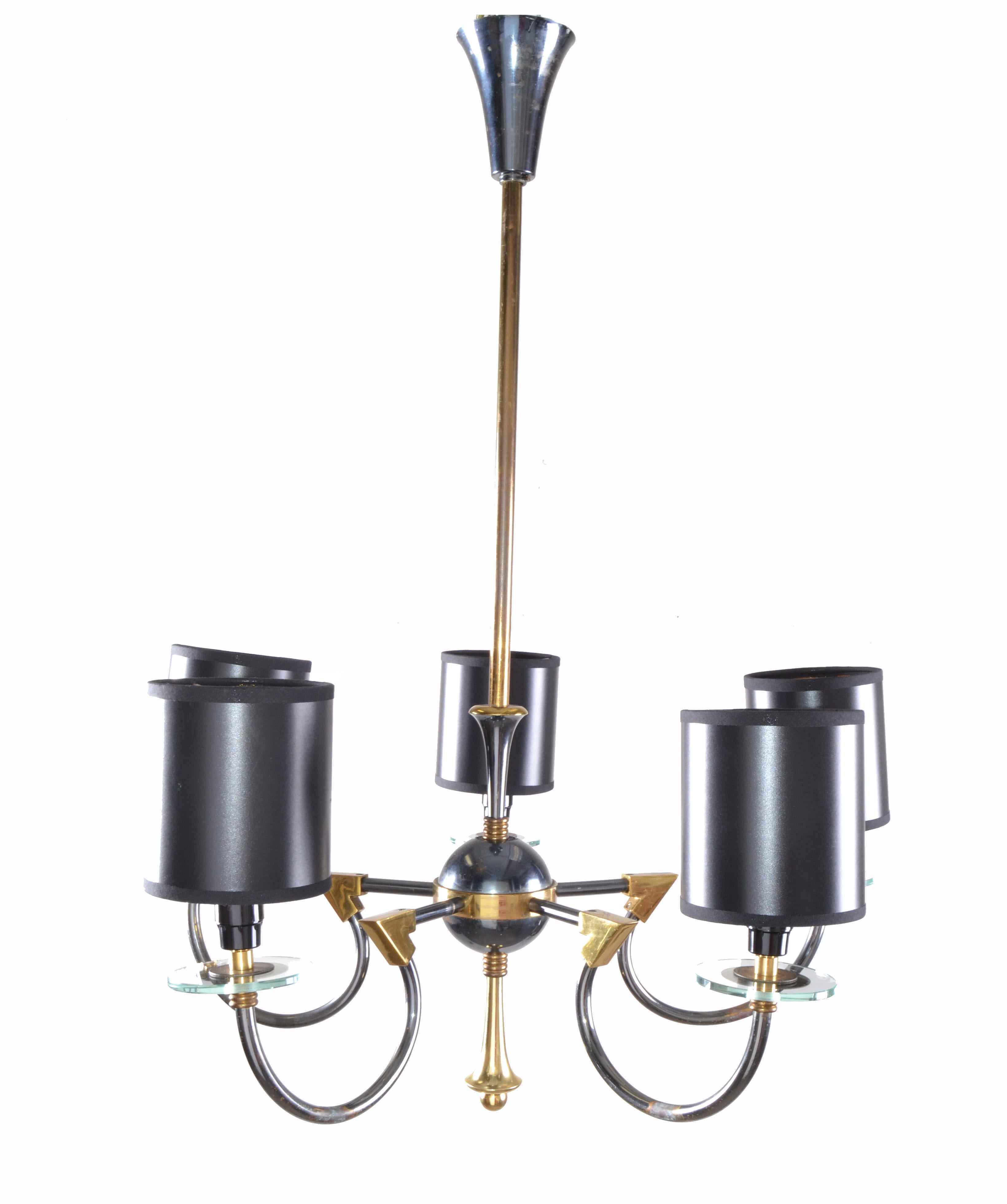 One of two Maison Jansen chandelier with two-tone metal finish, in a patina bronze and a dark gunmetal color.
Glass accents with clear glass round saucers on all pieces just under the sockets.
Sold with black shades: 4.38 inches H, 4 inches