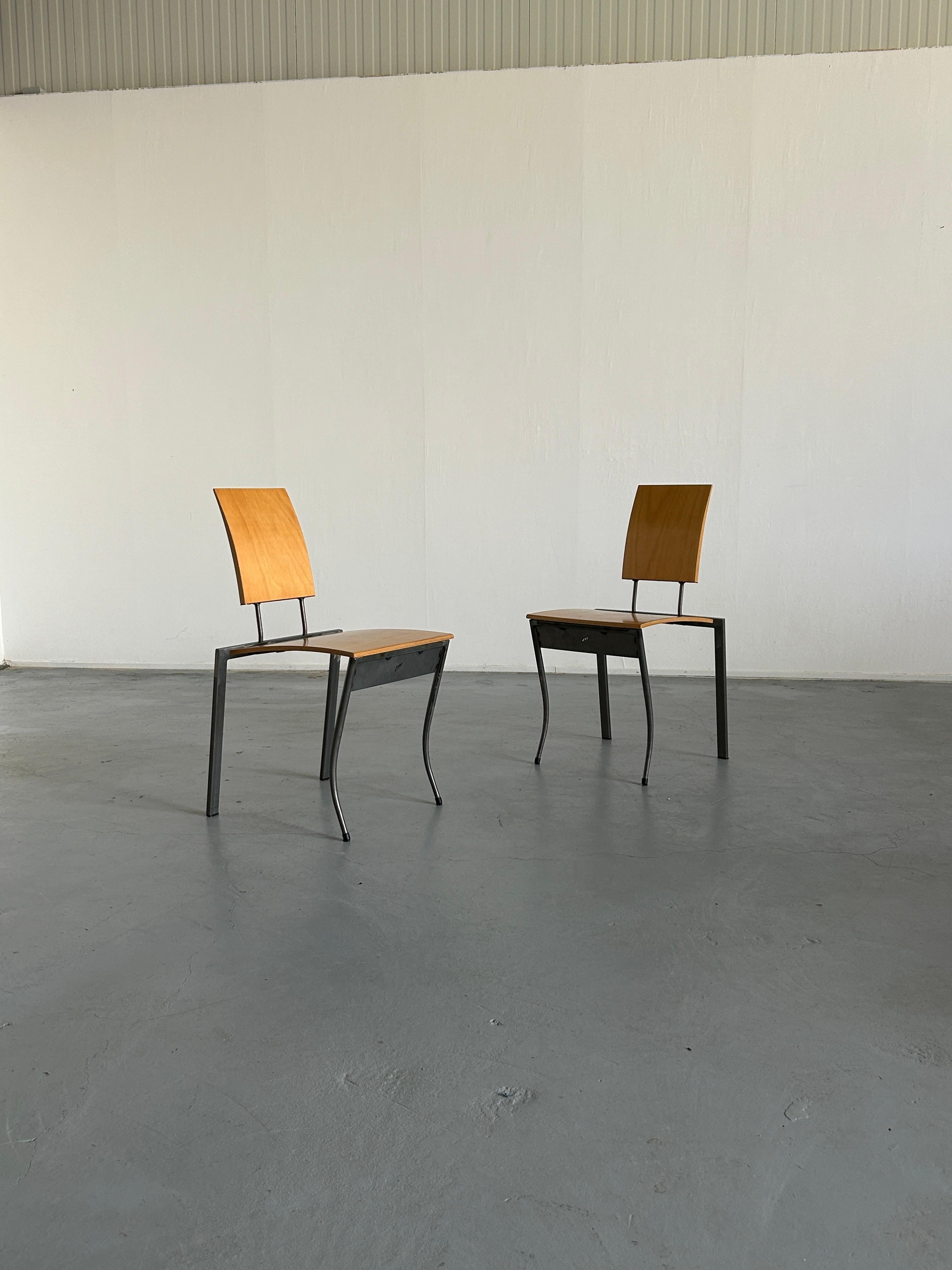 Two steel and plywood postmodern chairs designed in the 1980s in Germany by Karl Friedrich Förste for KFF, his own manufacturing company.
The chair has a slim rectangular three-dimensional gazzelle-like metal frame and a flat styled plywood